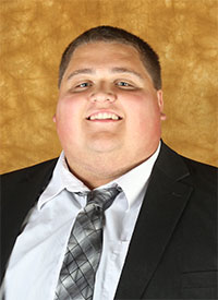 A headshot of St. Olaf Assistant Football Coach Alex Leicht.
