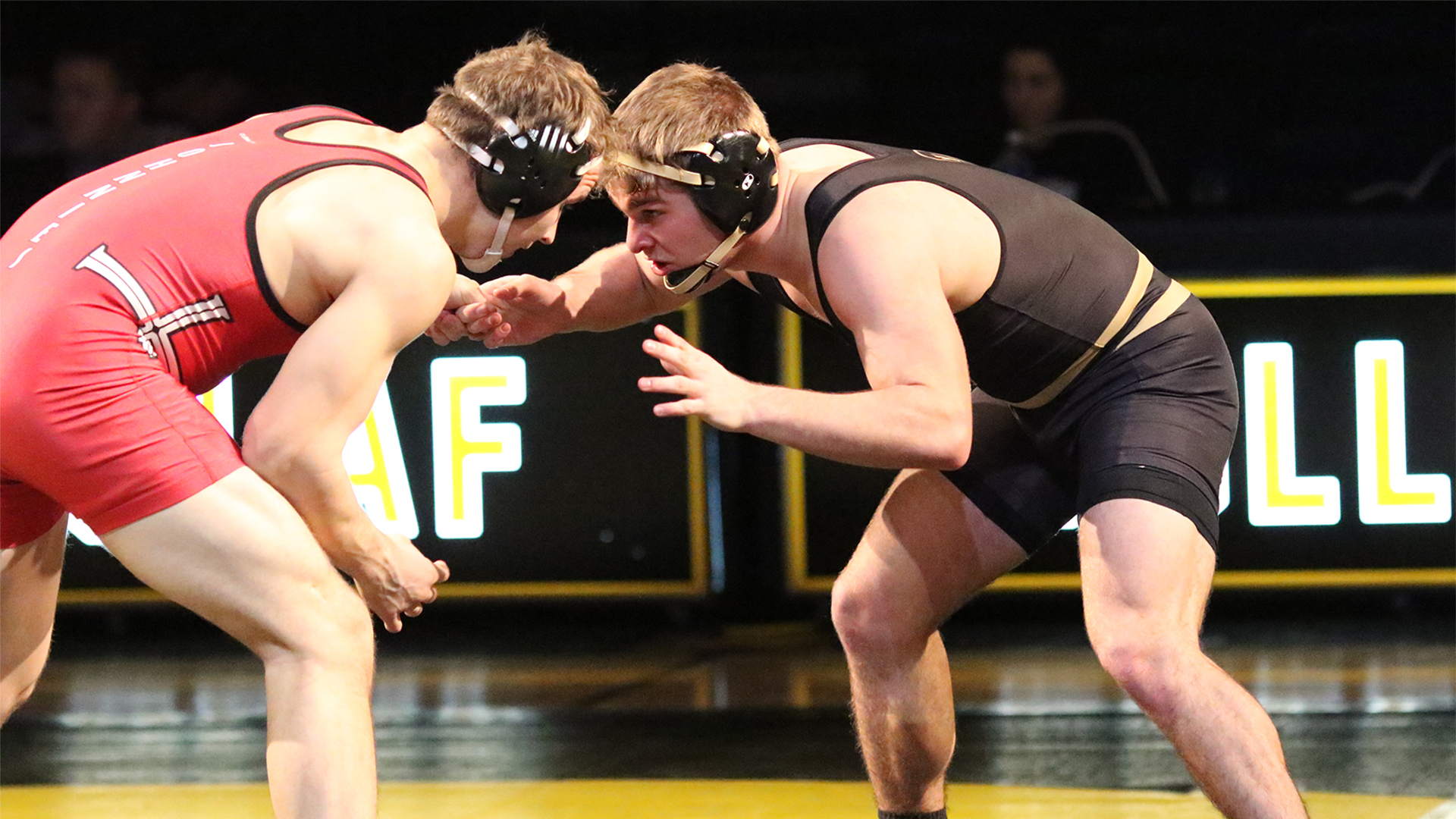 Kris Kurtz grapples his opponent from Saint John's.