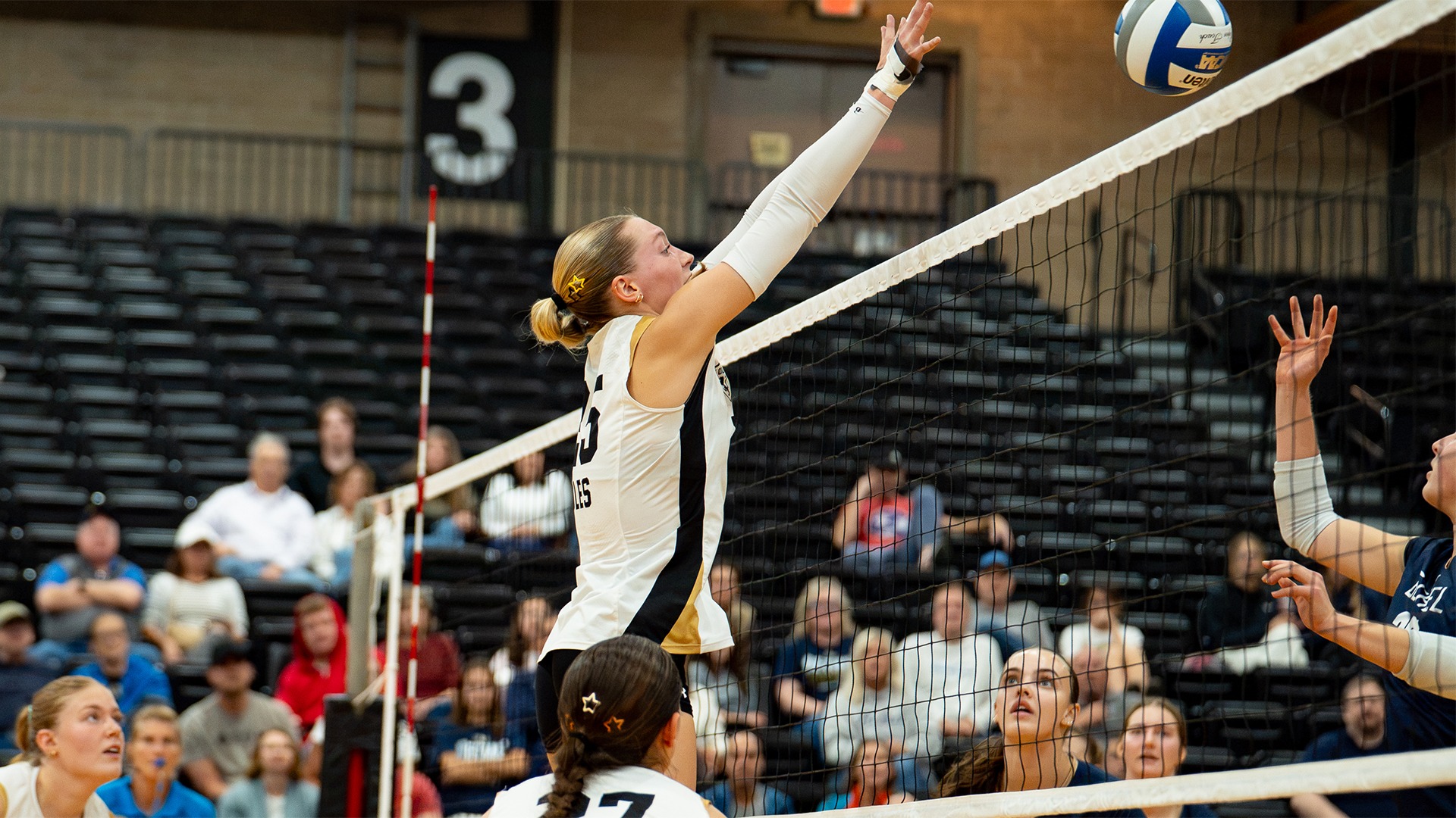 Maren Miller goes up for a block.