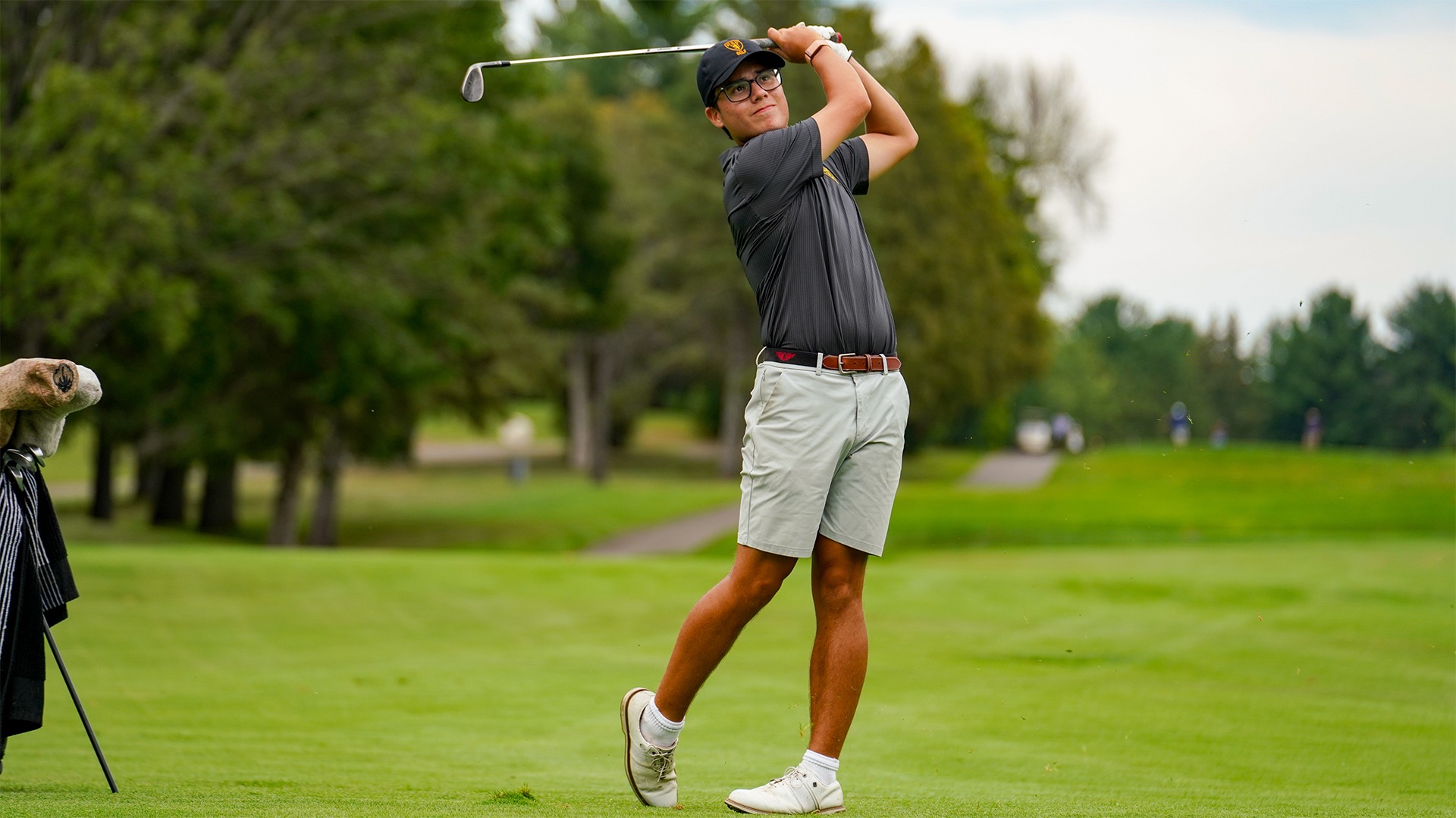 Ike Vessey hits an iron shot.