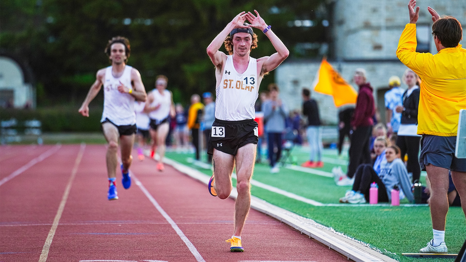 Kevin Turlington crosses the line at the MIAC Outdoor Track & Field Championships.