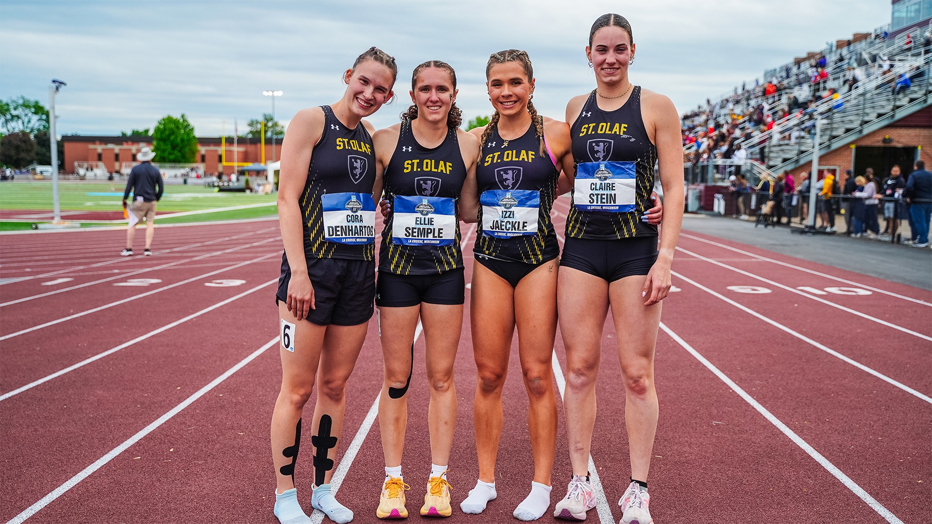 St. Olaf's women's 4x400-meter relay poses on the track.