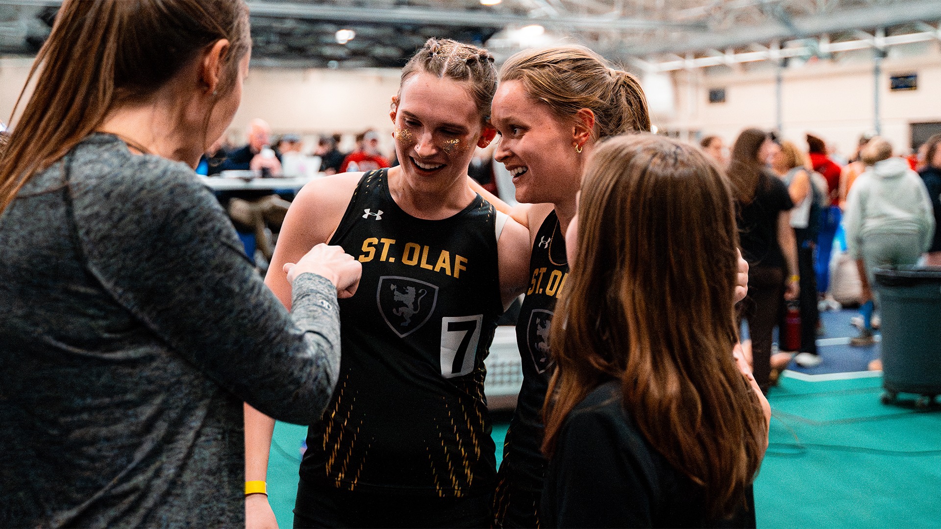 Cora DenHartog and Isabel Wyatt huddle after a race.