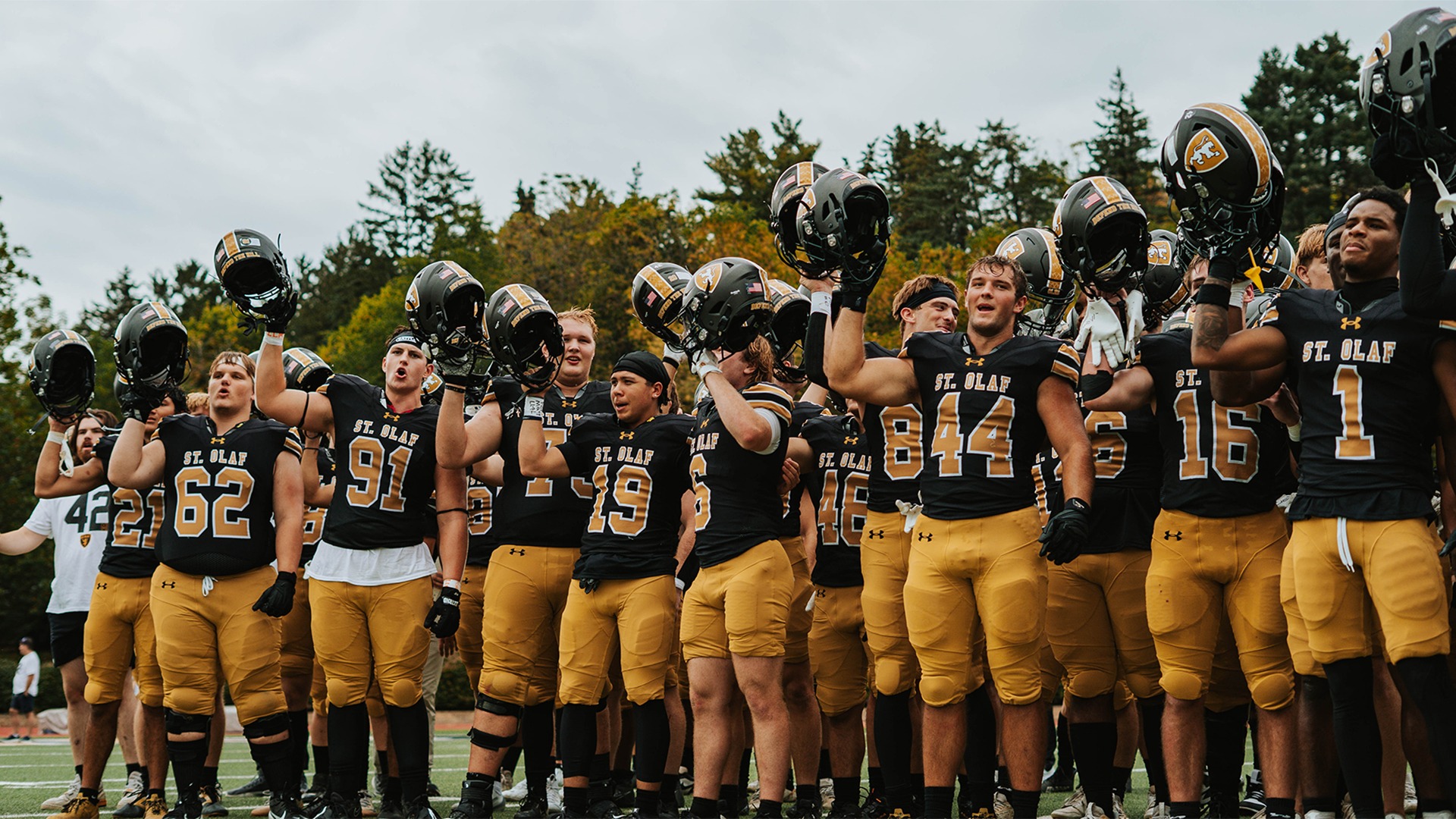 The St. Olaf football team sings Um! Yah! Yah! after a win over Concordia-Moorhead.