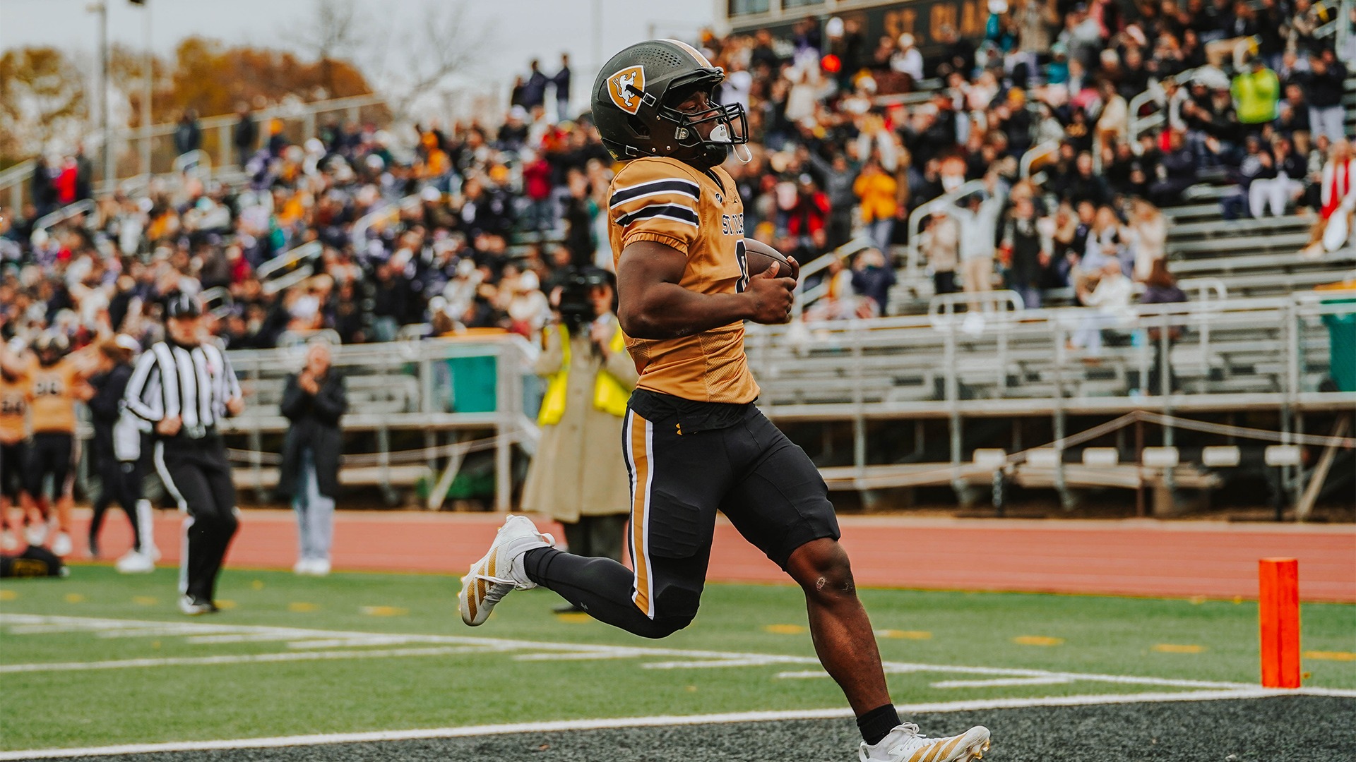 Bryon Sauvy runs into the end zone against St. Scholastica.