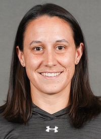 A headshot of St. Olaf head women's track and field coach Patti Bayer.