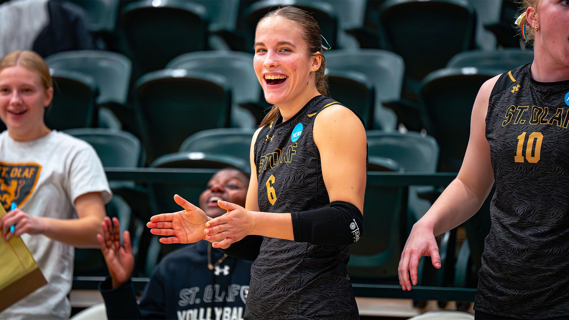 Lauren Welch smiles on the sideline during a match against Northwestern.