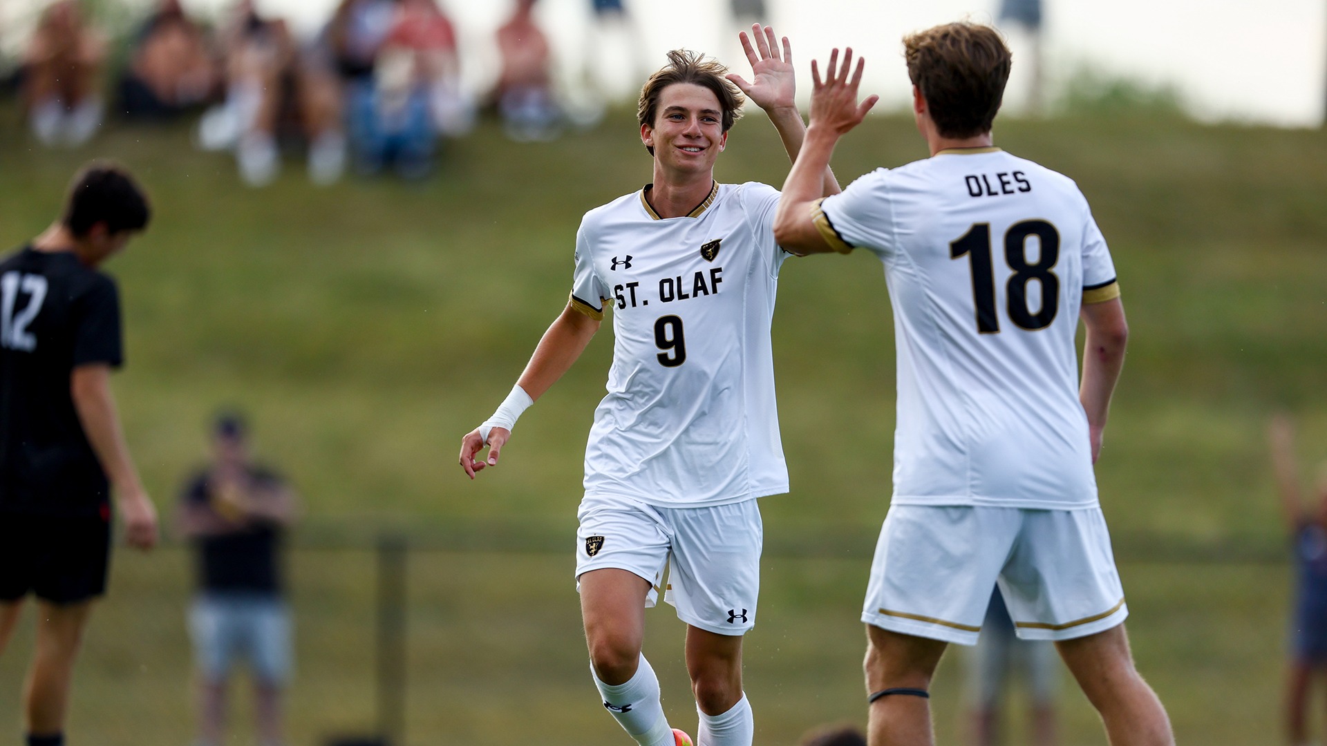 Jack Soares high-fives Ryan Wilson after a goal.