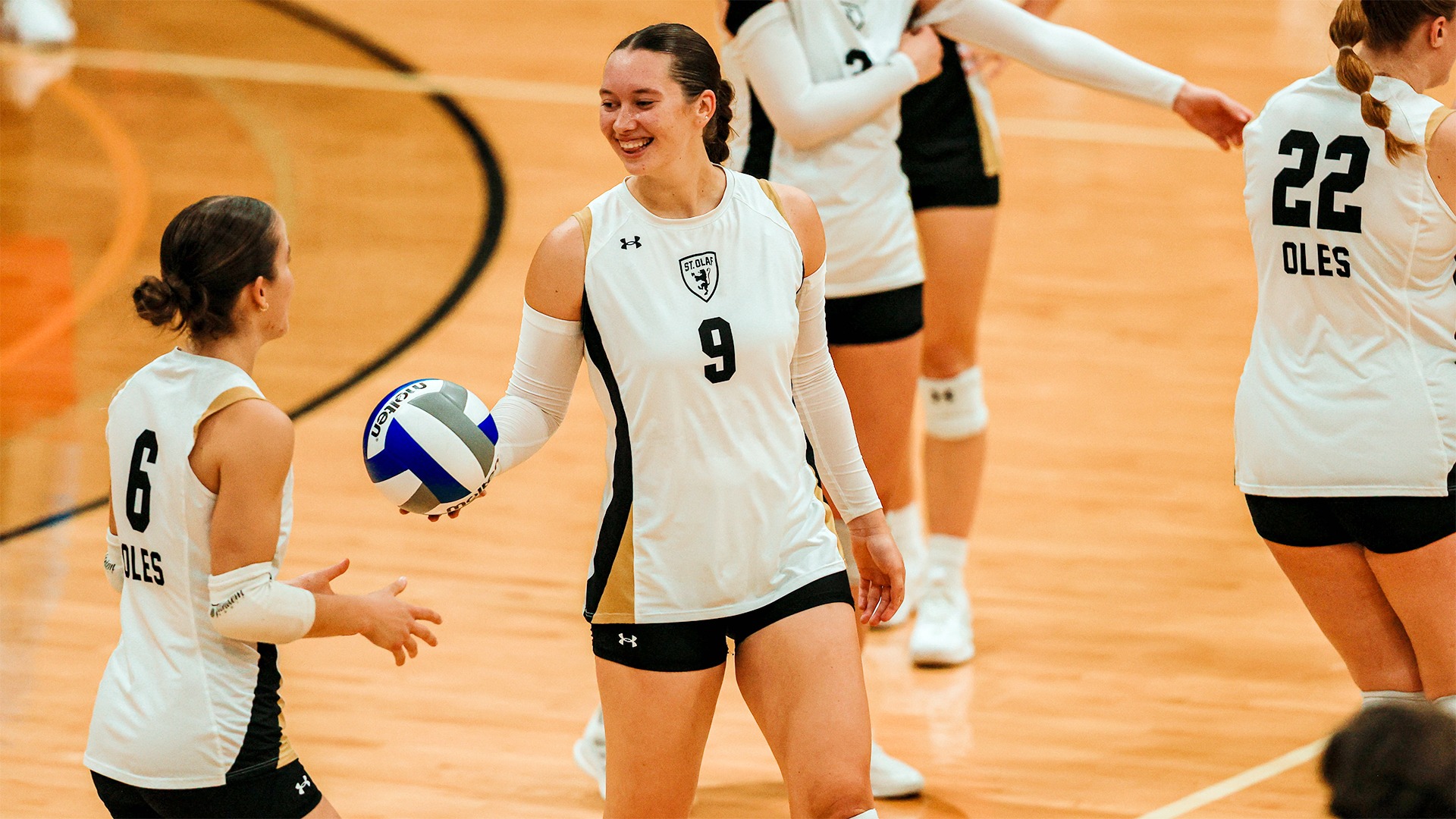 Mehsa Krause smiles while holding the ball.