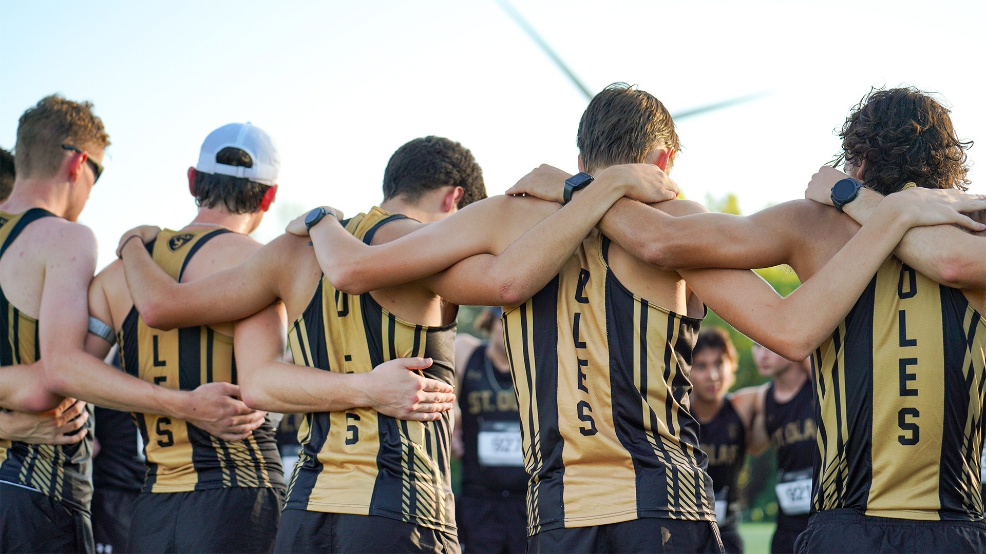 The men's cross country team huddles before a race.