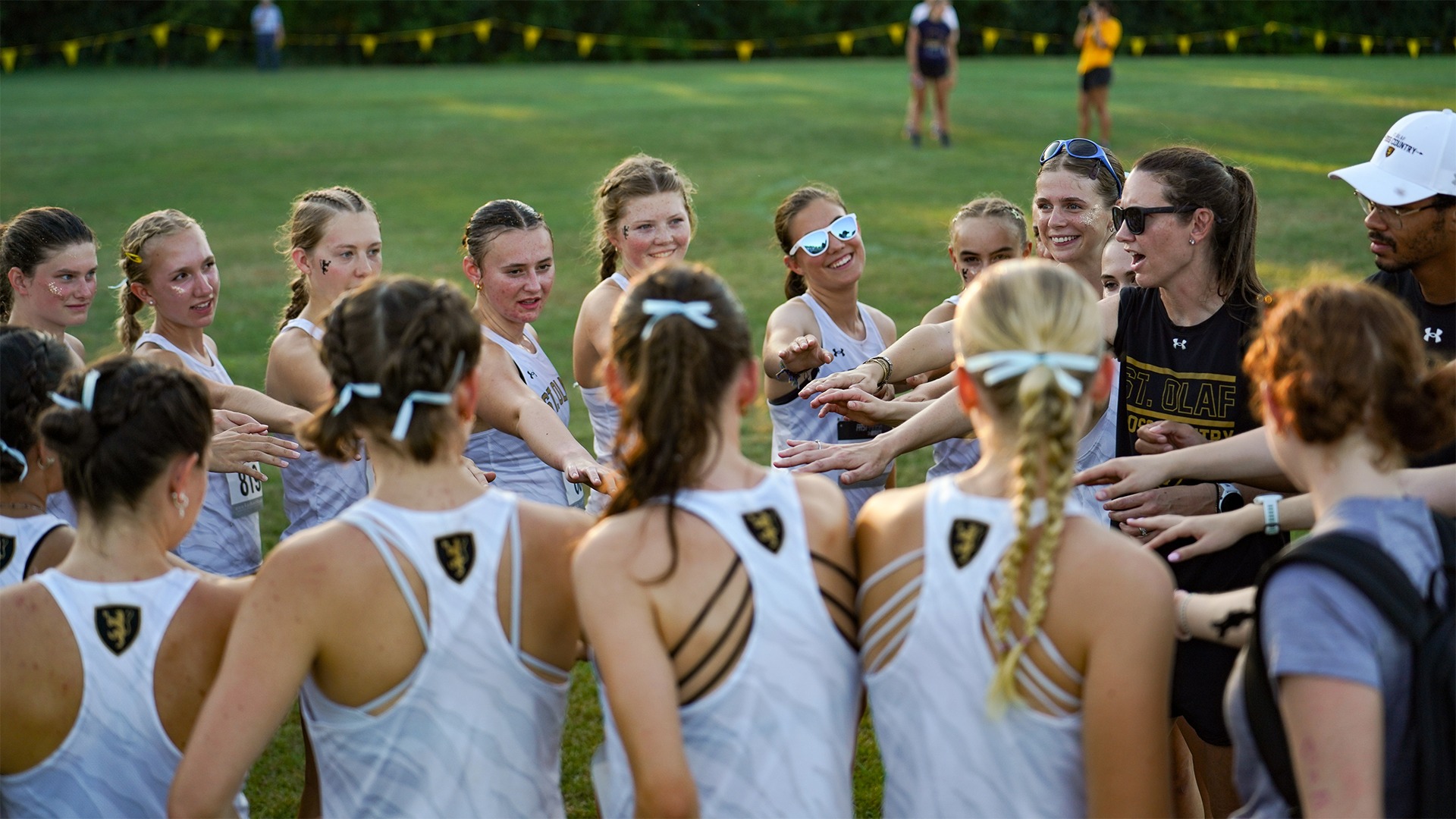 The women's cross country team huddles before a race.