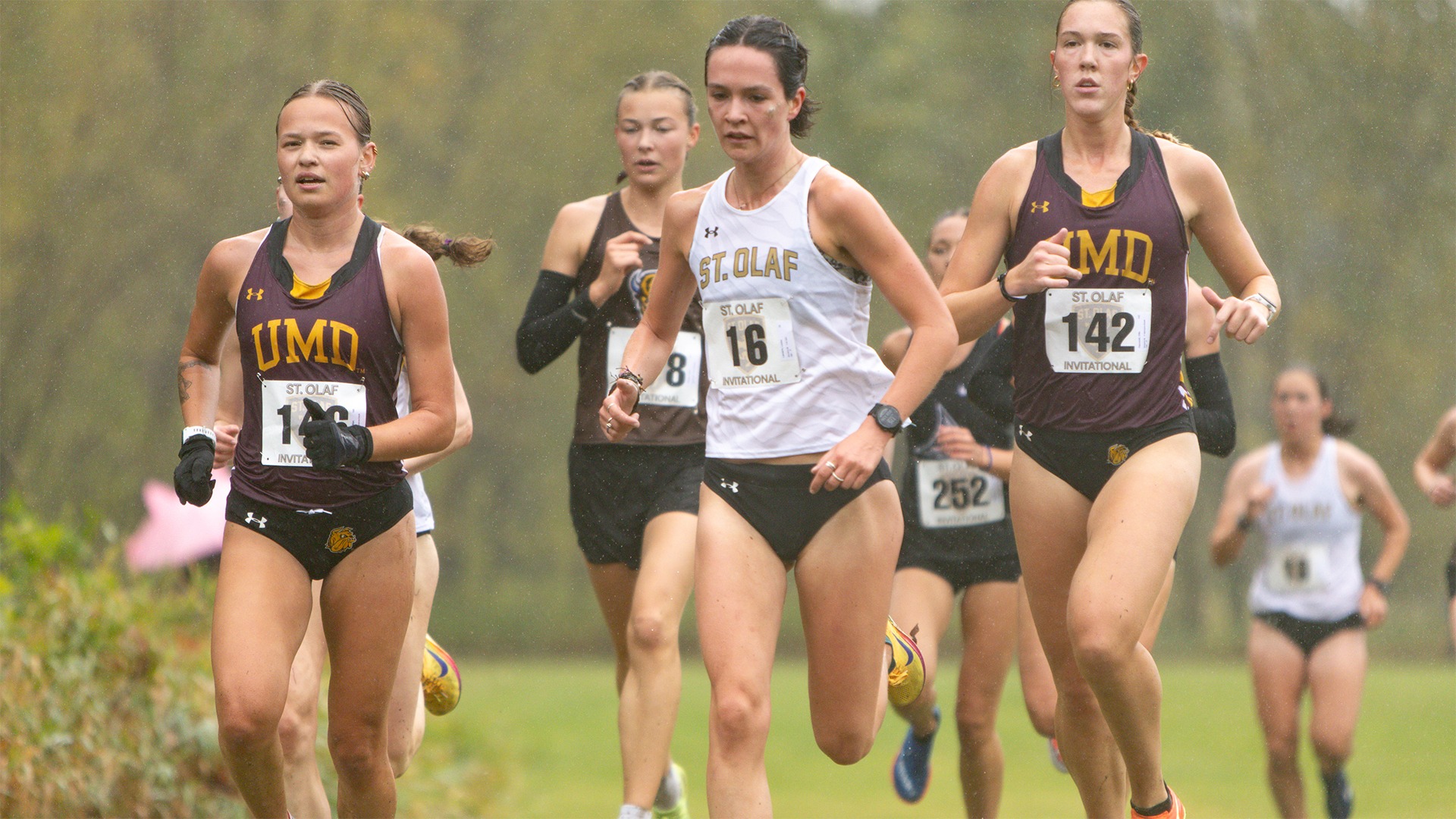 Louisa Lamarre runs on the course in the rain.