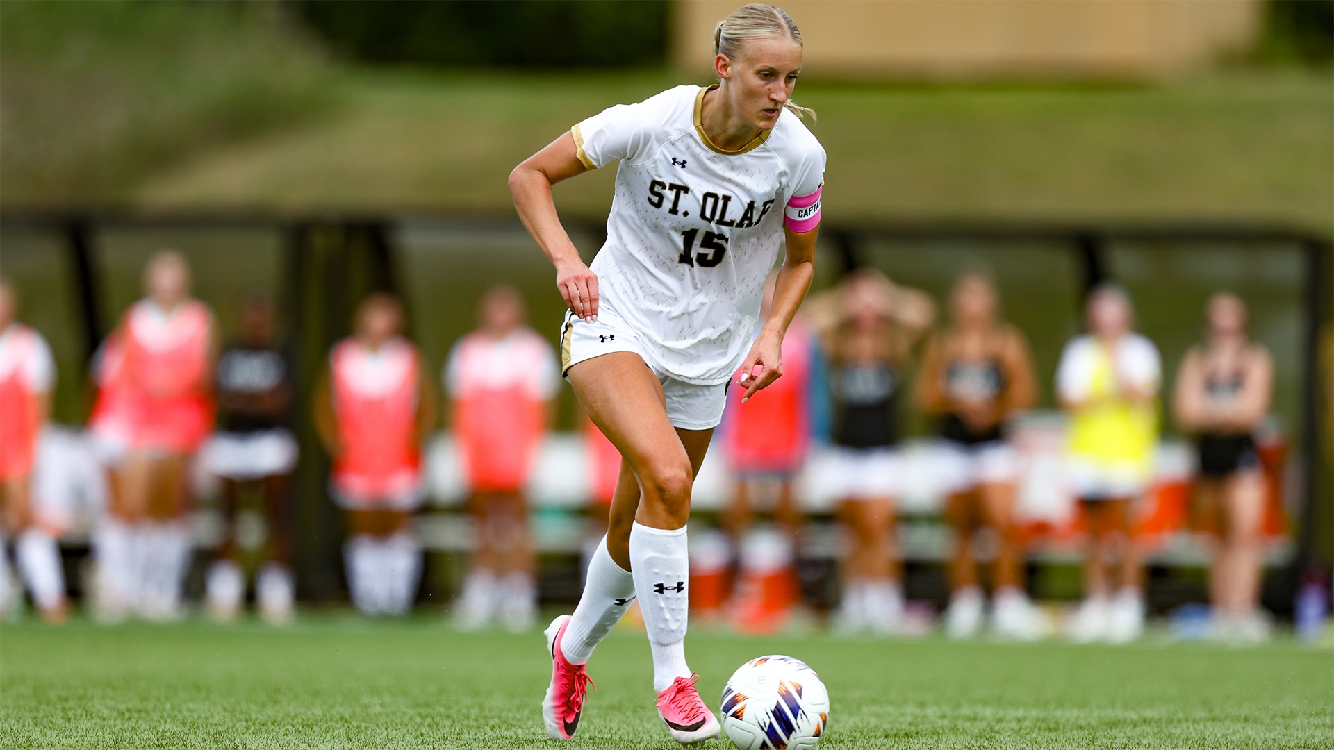 Emily Johnson dribbes the ball against Wartburg.