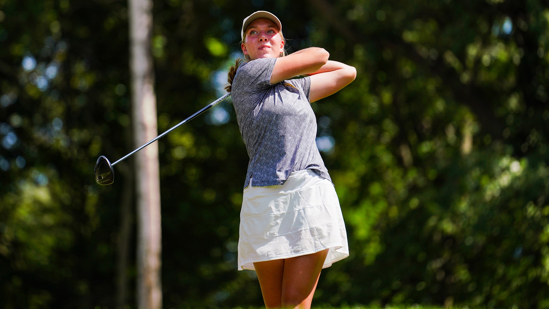 Sarah Dove tees off in a practice round.