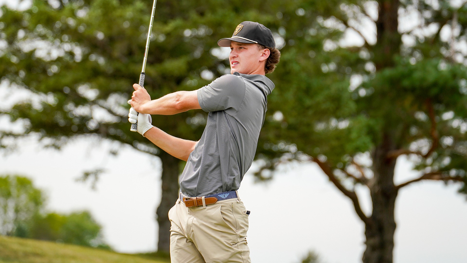 Will Black hits an iron shot.
