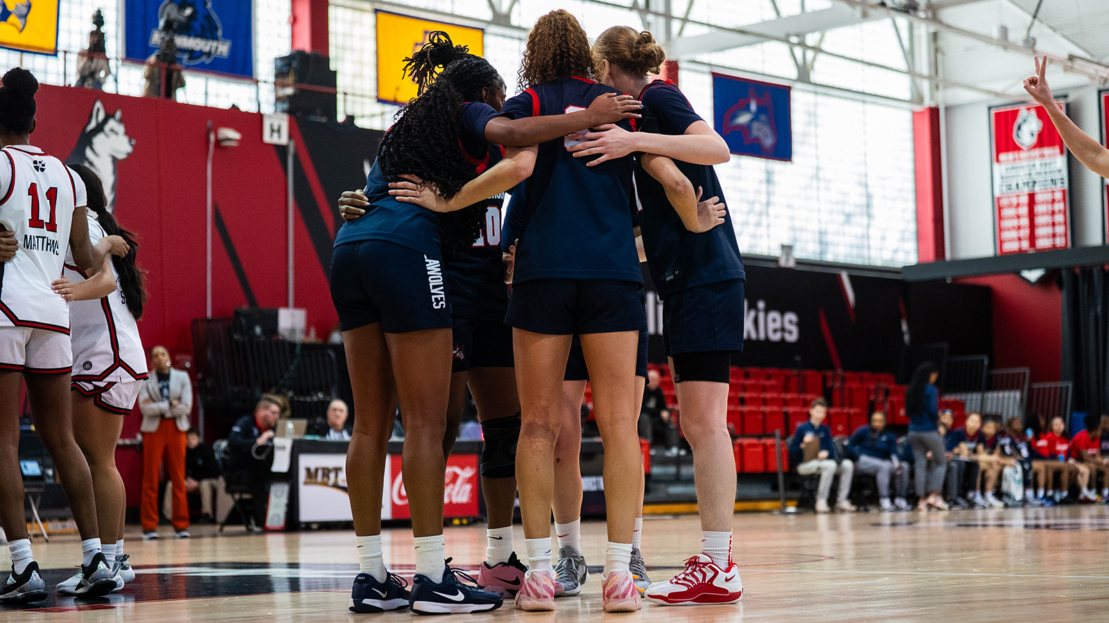 WBB huddle Northeastern