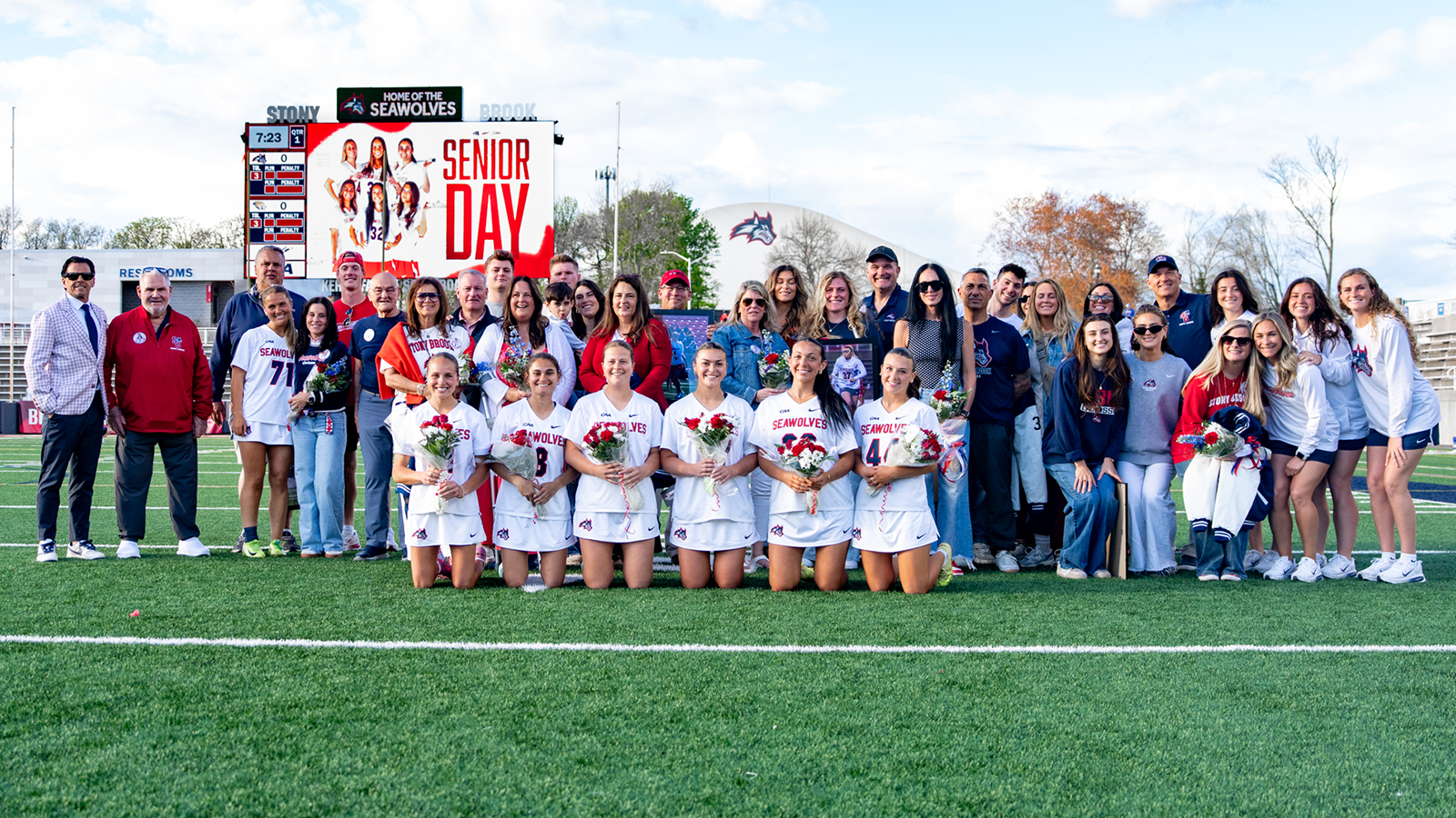 Stony Brook women's lacrosse 2026 Senior Class takes a picture with staff, family and friends. 