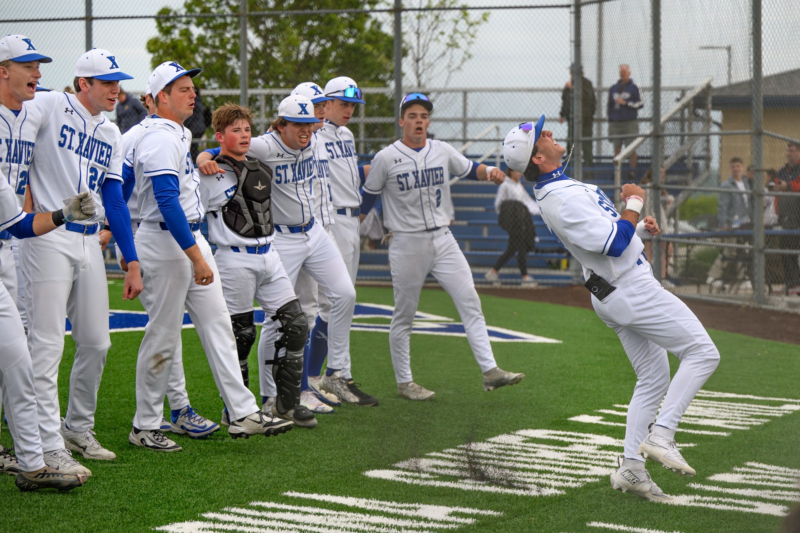 Bombers celebrate after defeating the Moeller Crusaders 10-0