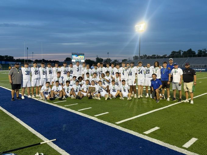 The Bombers lacrosse team hoist the fifth straight regional trophy