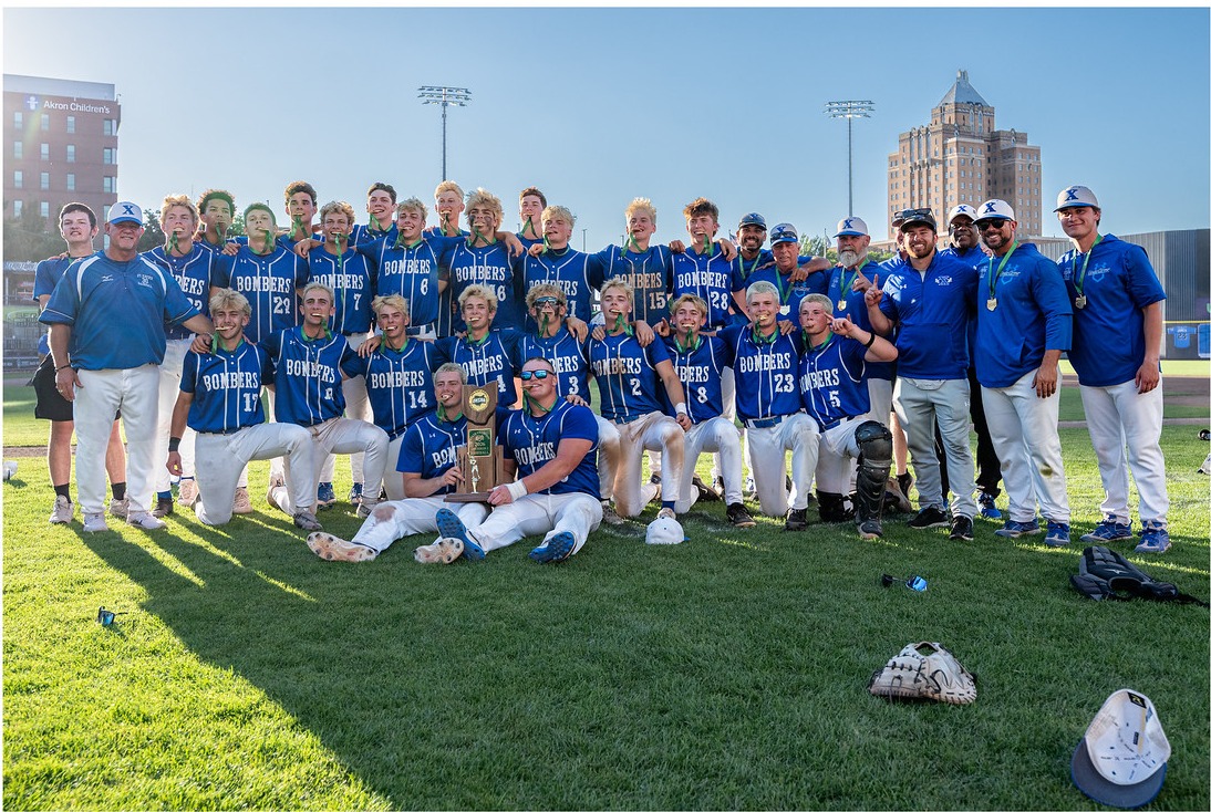 Bomber Baseball pose with state title trophy and medals after defeating the Crusaders 4-2 