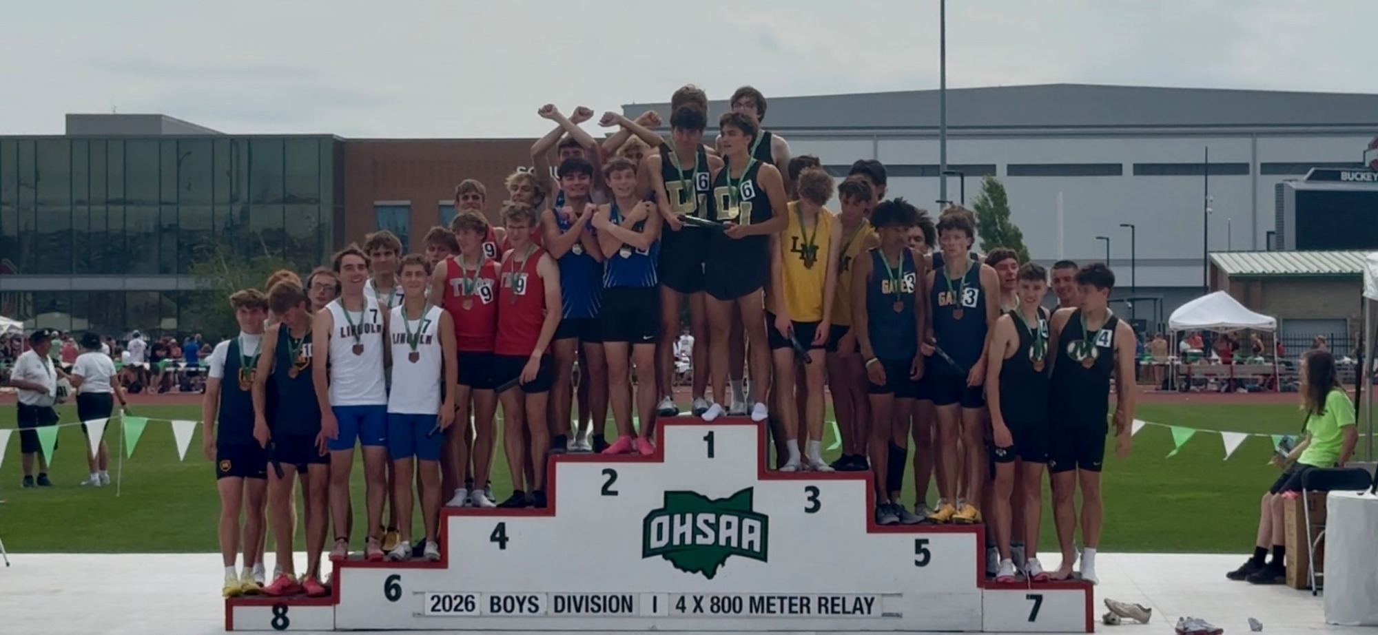 Bomber 4x800 team holds up the X after placing runner up in state 
