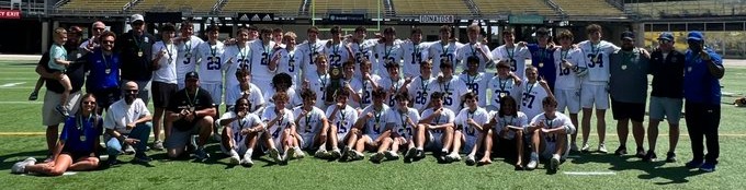 Bomber lacrosse pose after winning back-to-back state titles 