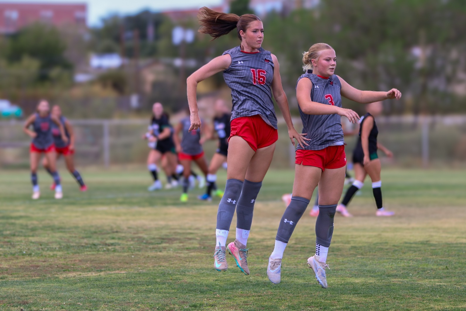 26 WSOC Aidan Proud (16) and Melody Richards (3) rise up to block the free kick