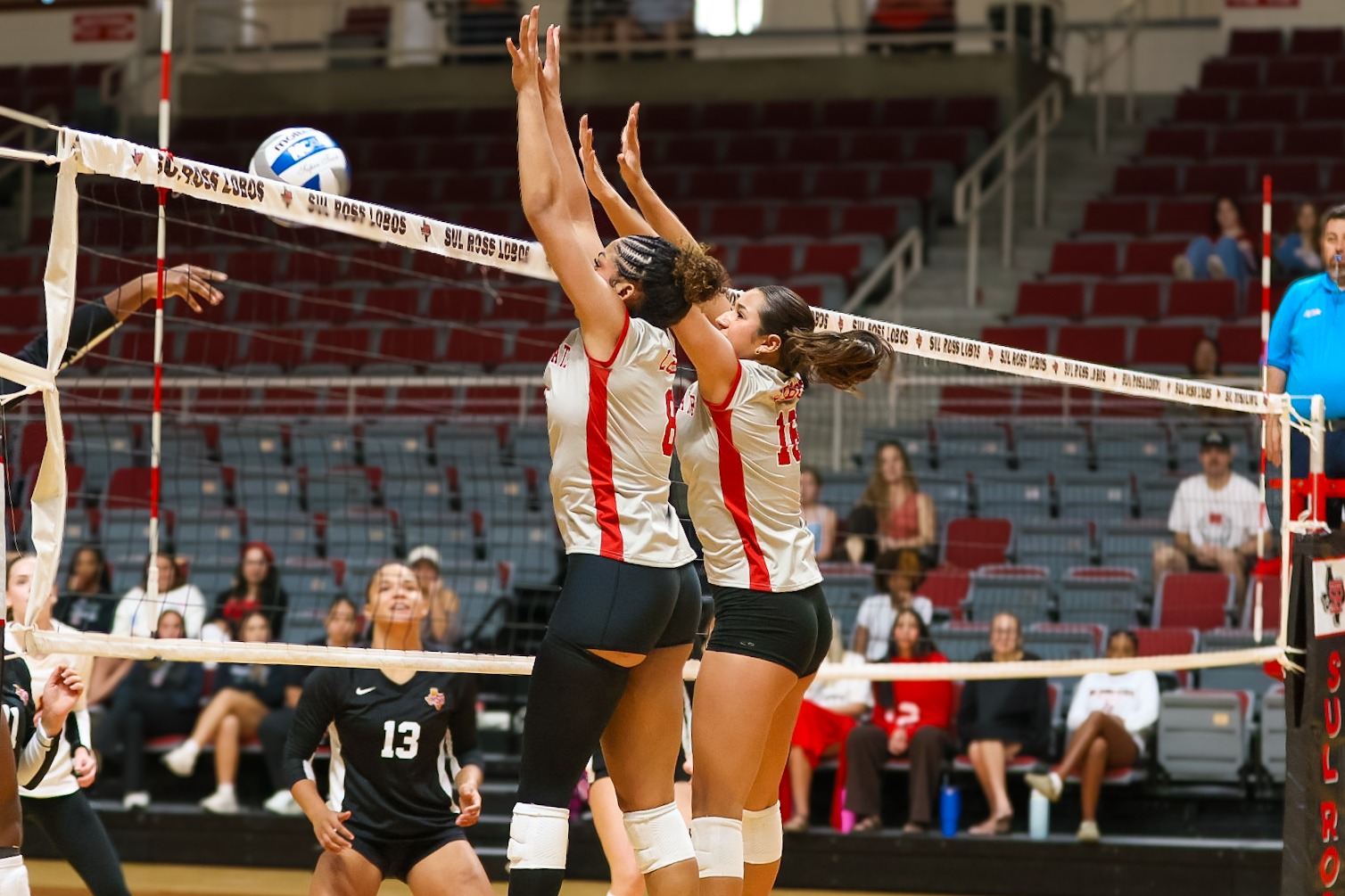 26 VB Lobos stuff the Midwestern State hitter