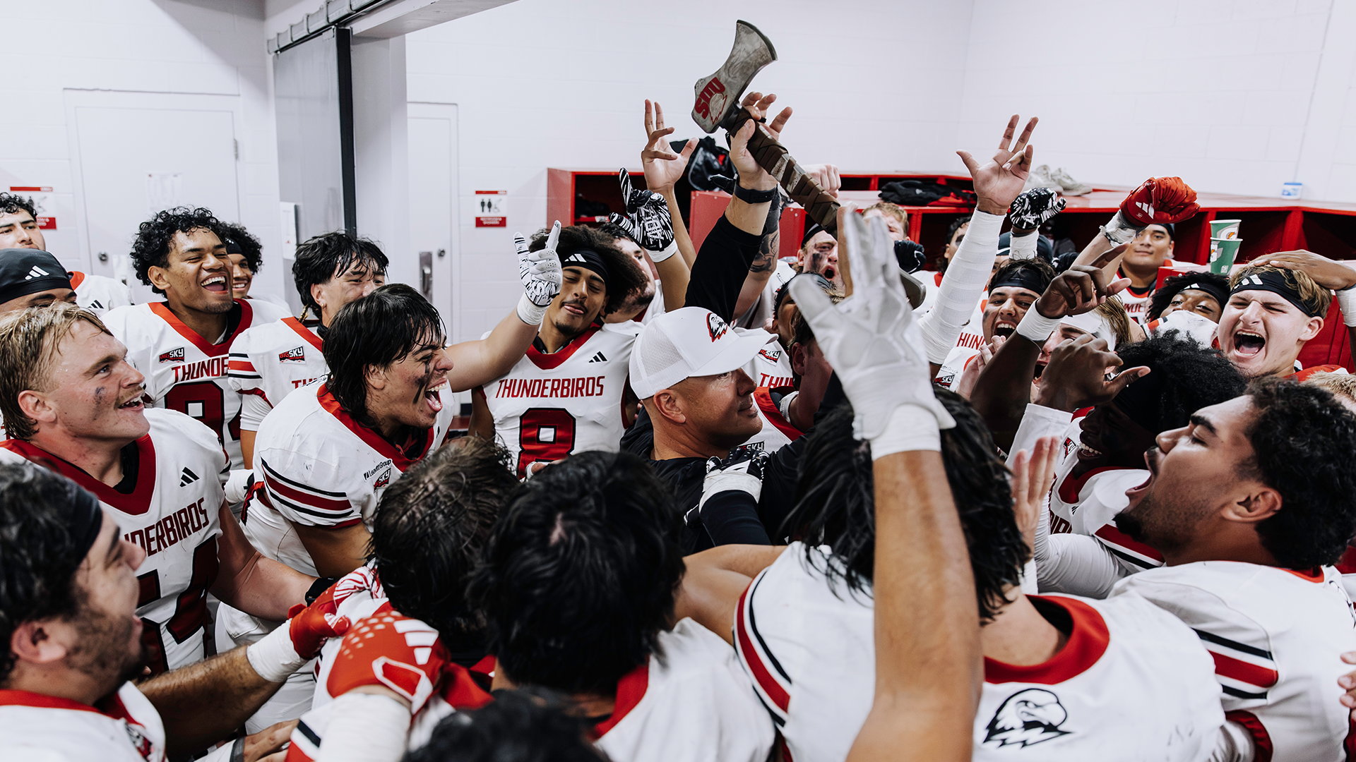 Team Celebration in the locker room with the Ax