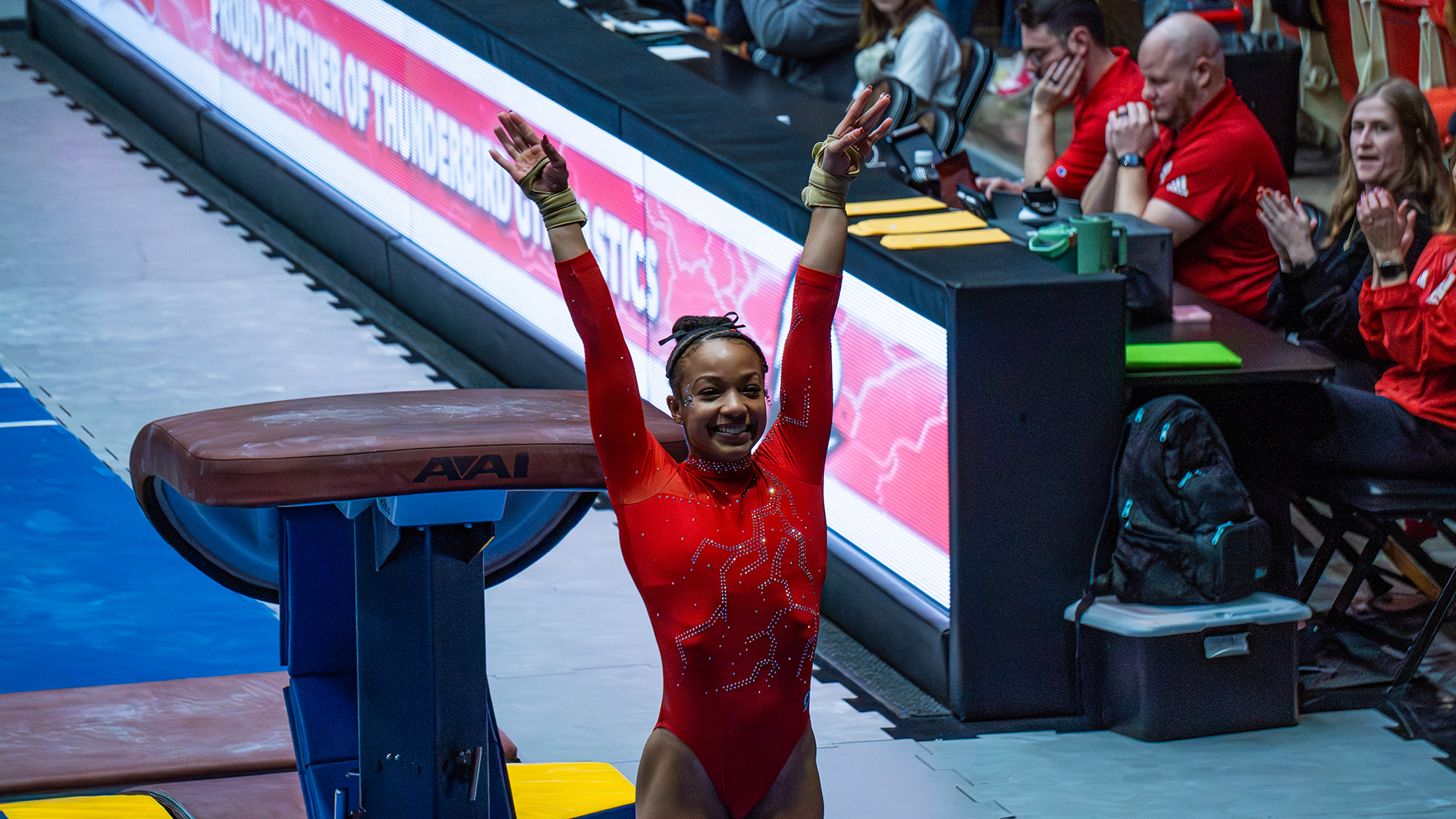 Niya Randolph saluting on the vault