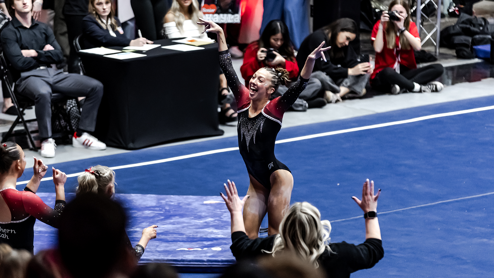 Carilia Martinez on the floor hypes up the crowd