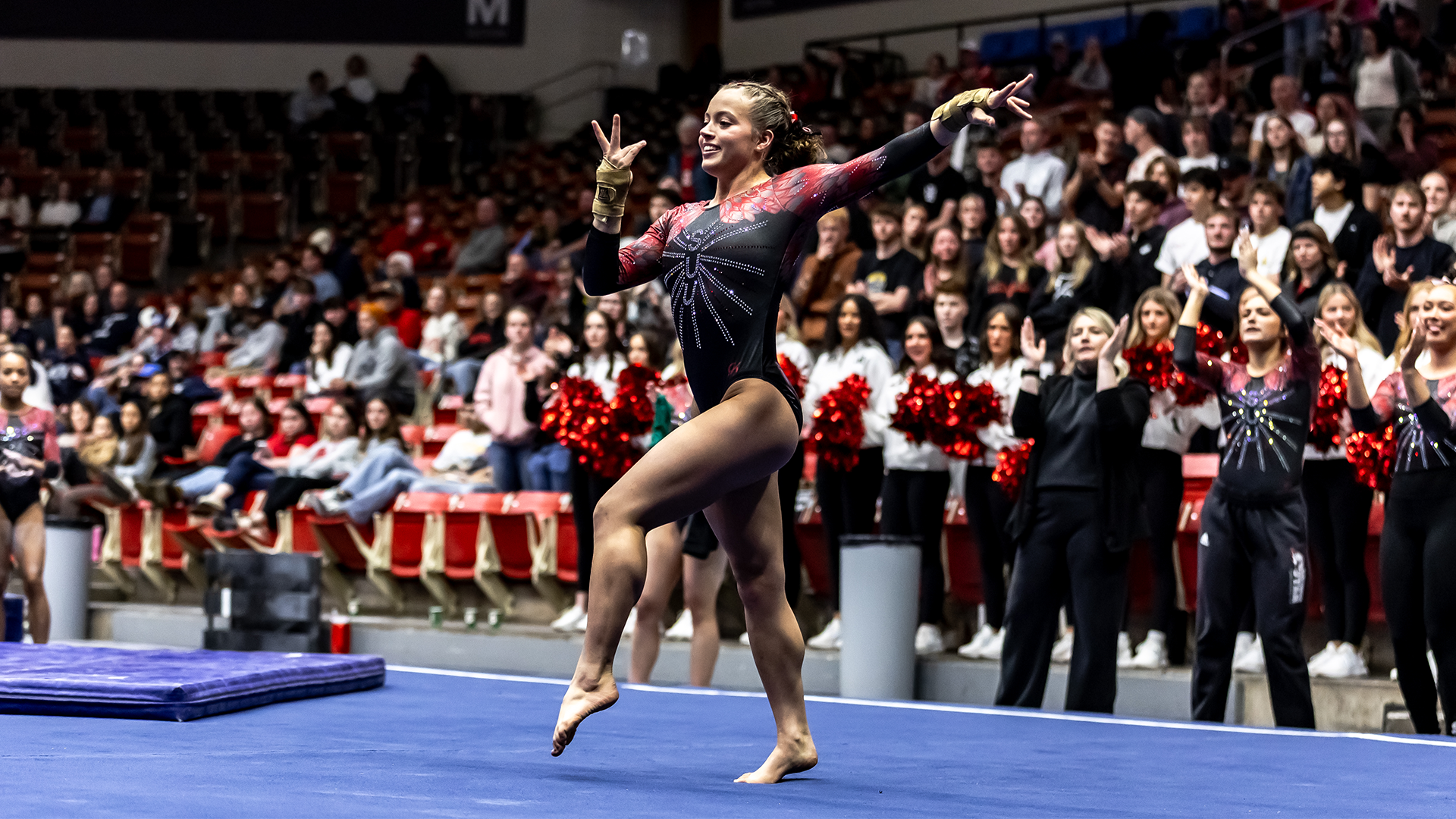 Berlin Hall on the floor going into her leaps