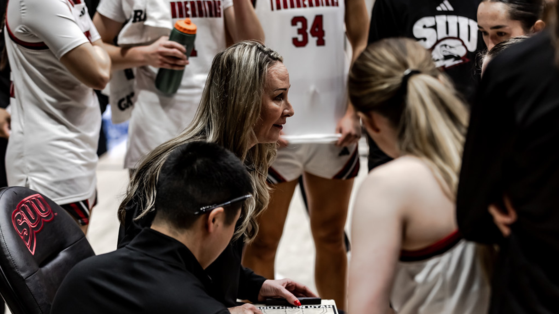 Tracy Mason coaches her team during a timeout
