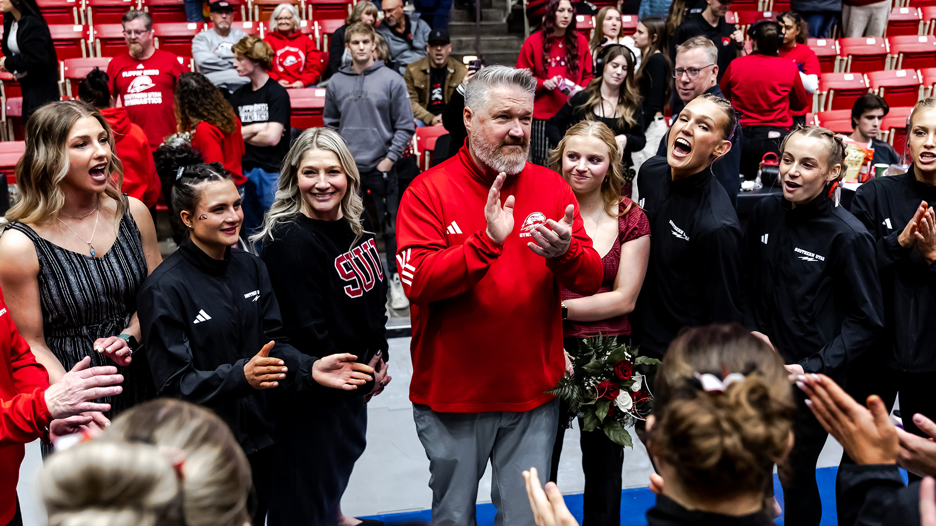 Scotty Bauman talking to his team before the meet