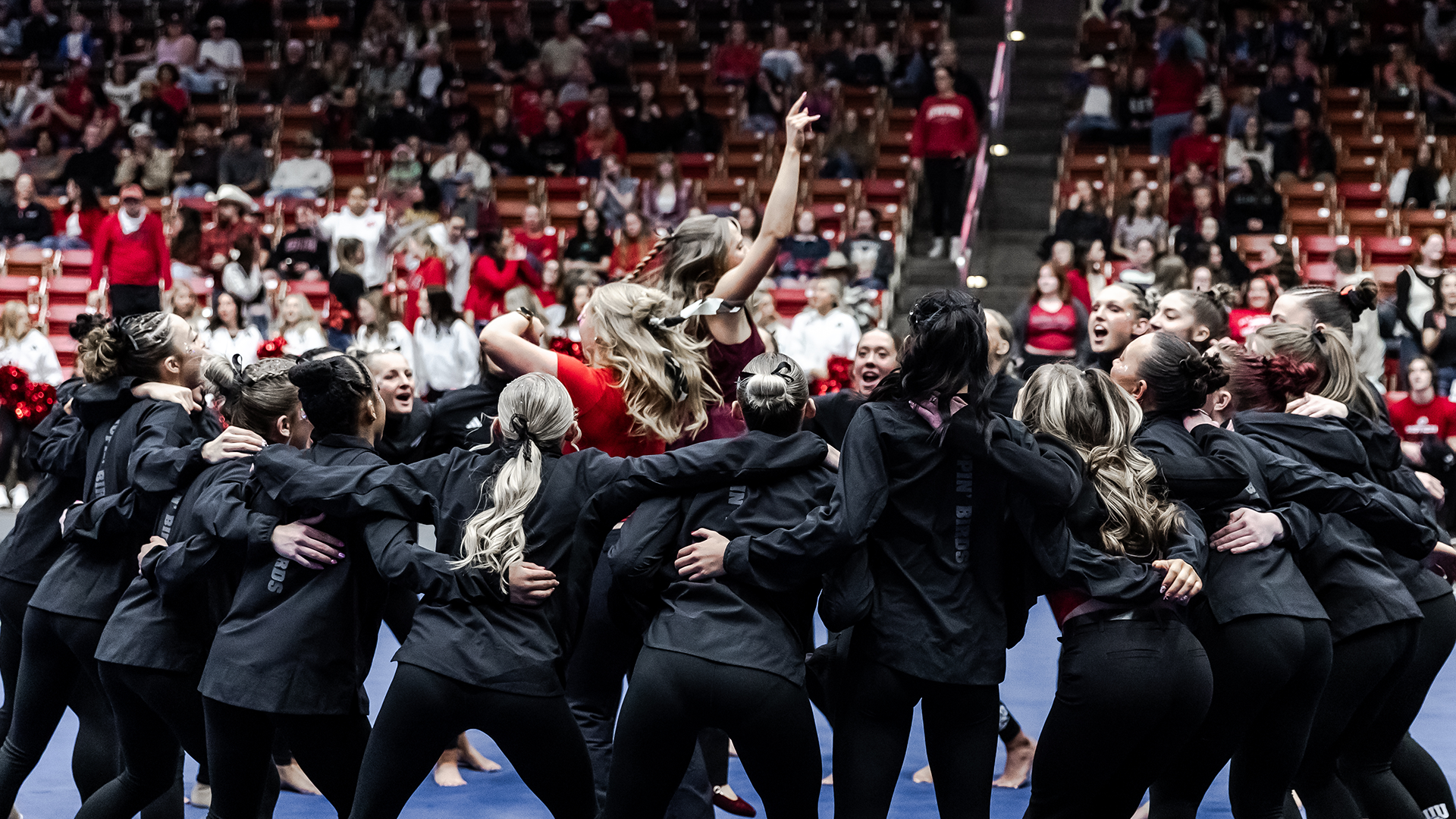 Gymnastics team cheering before the meet