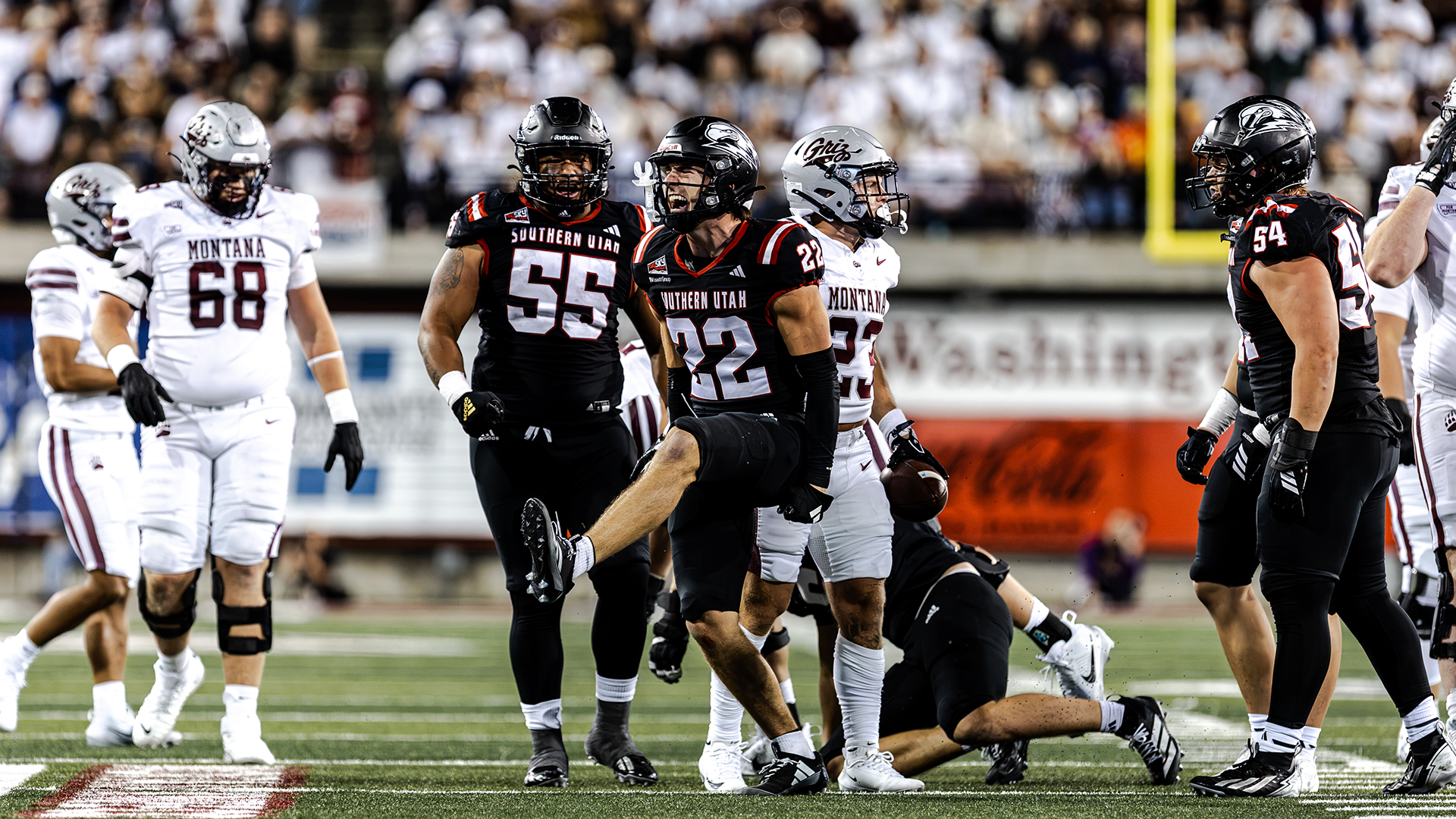Parker Vance and Seni Tuiaki celebrate a play 