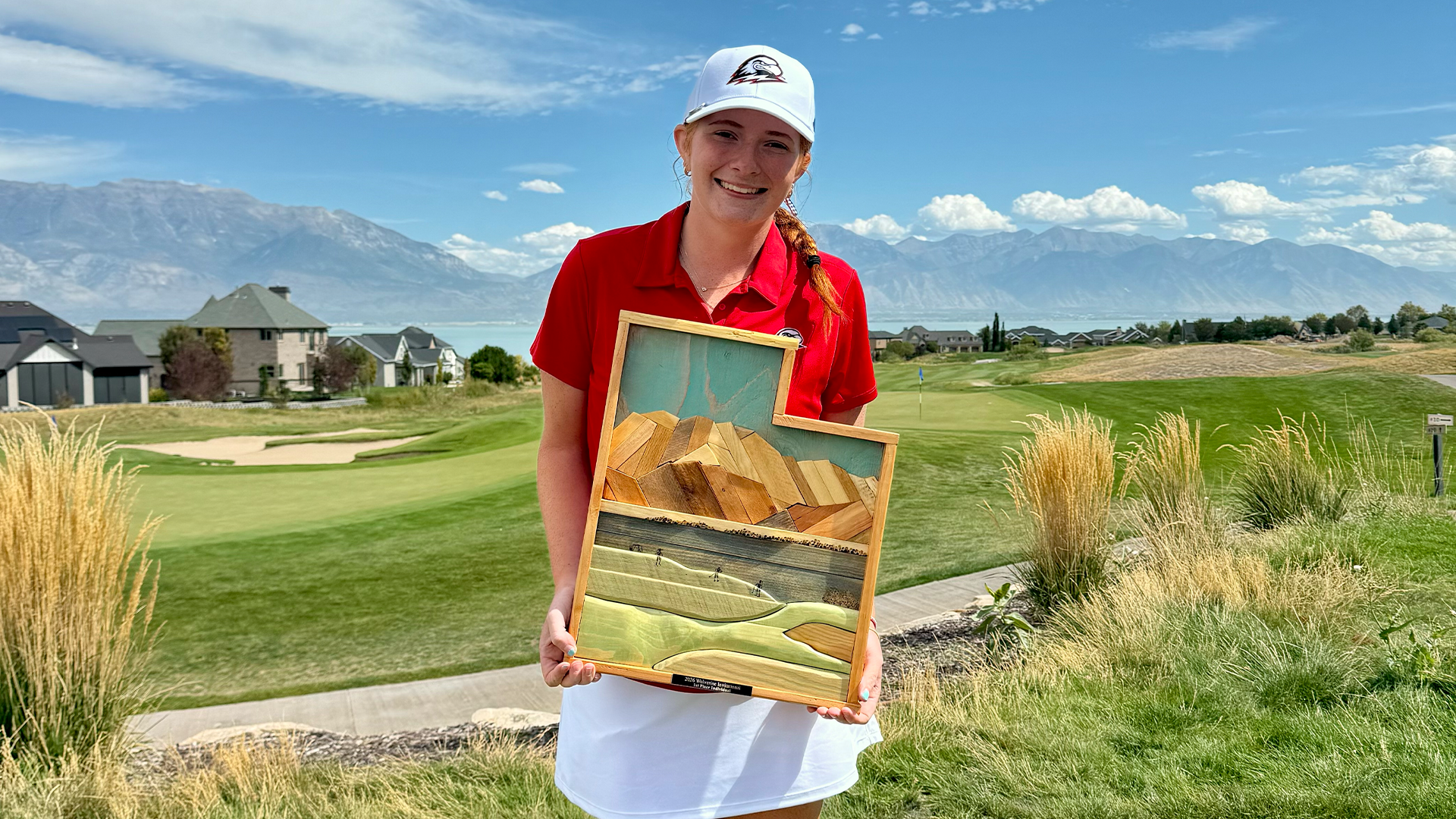 Saylar May with her trophy from the Wolverine invitational
