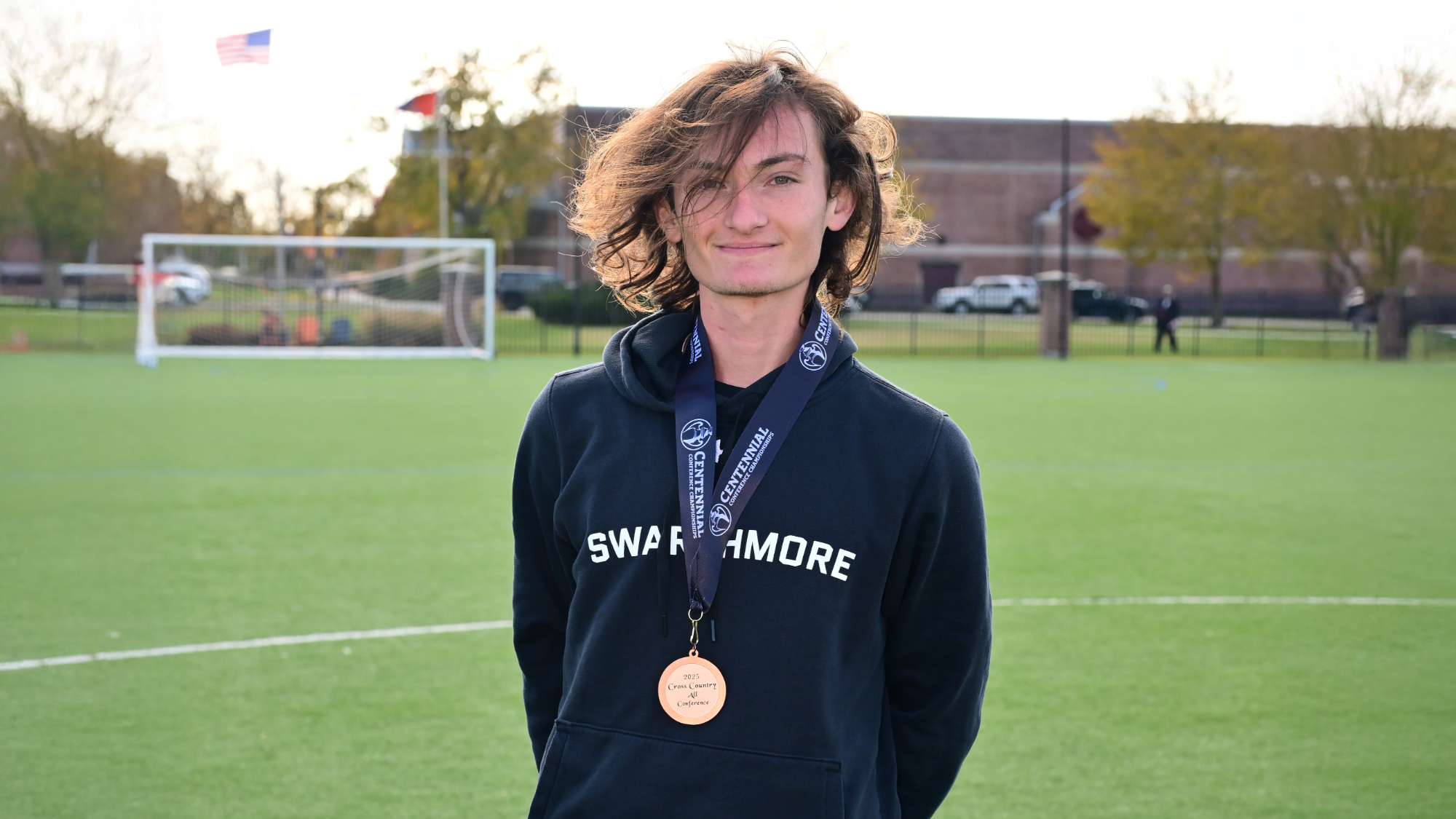 Cohen Manges poses with his All-Centennial medal at the 2025 cross country championships