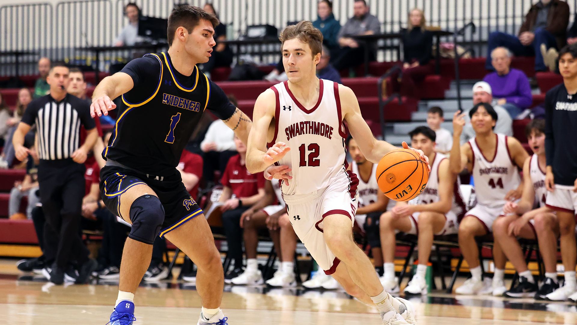 Cal Hanson dribbles to lane against Widener