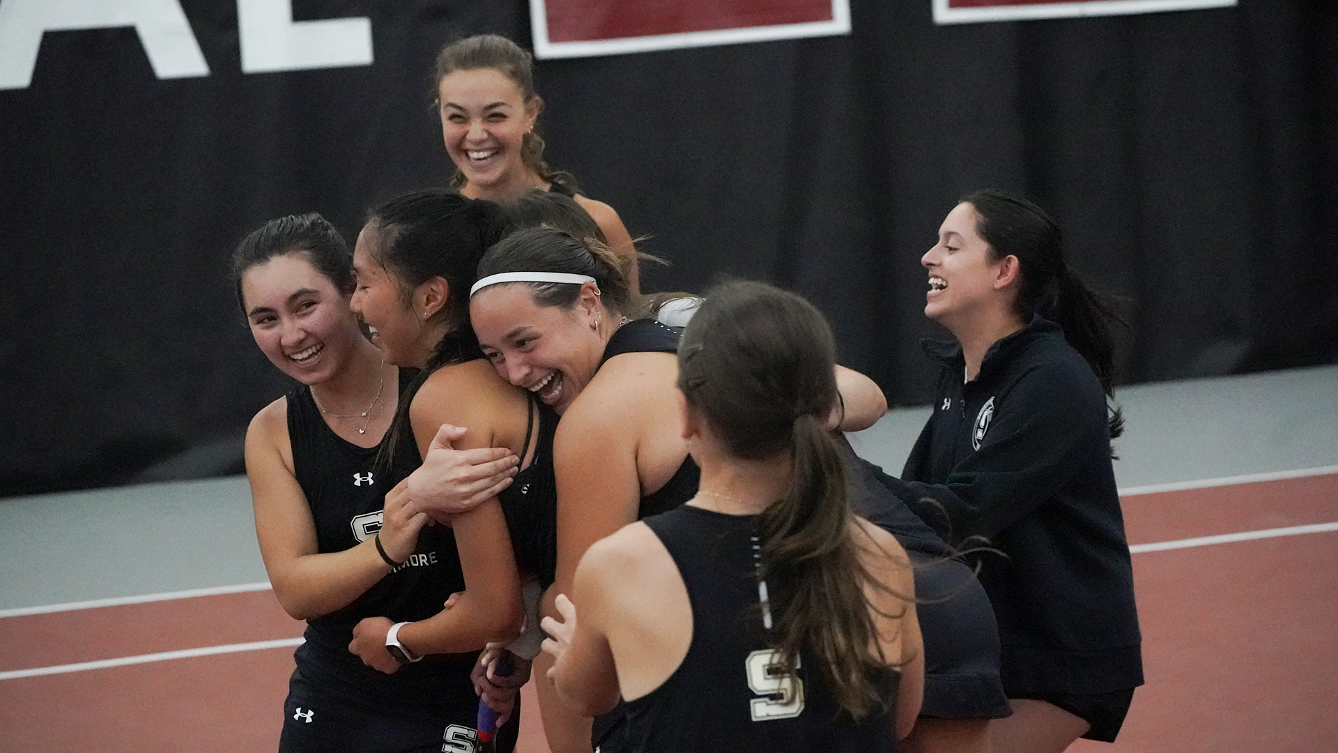 women's tennis celebrating centennial title
