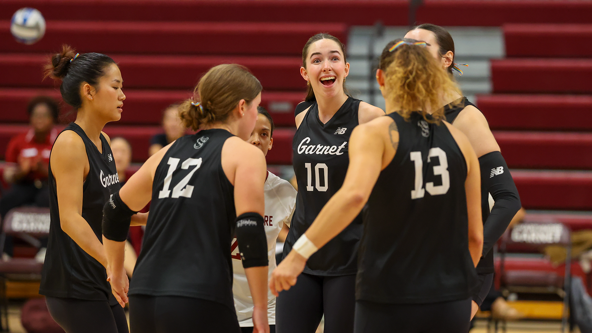 Volleyball huddles after point