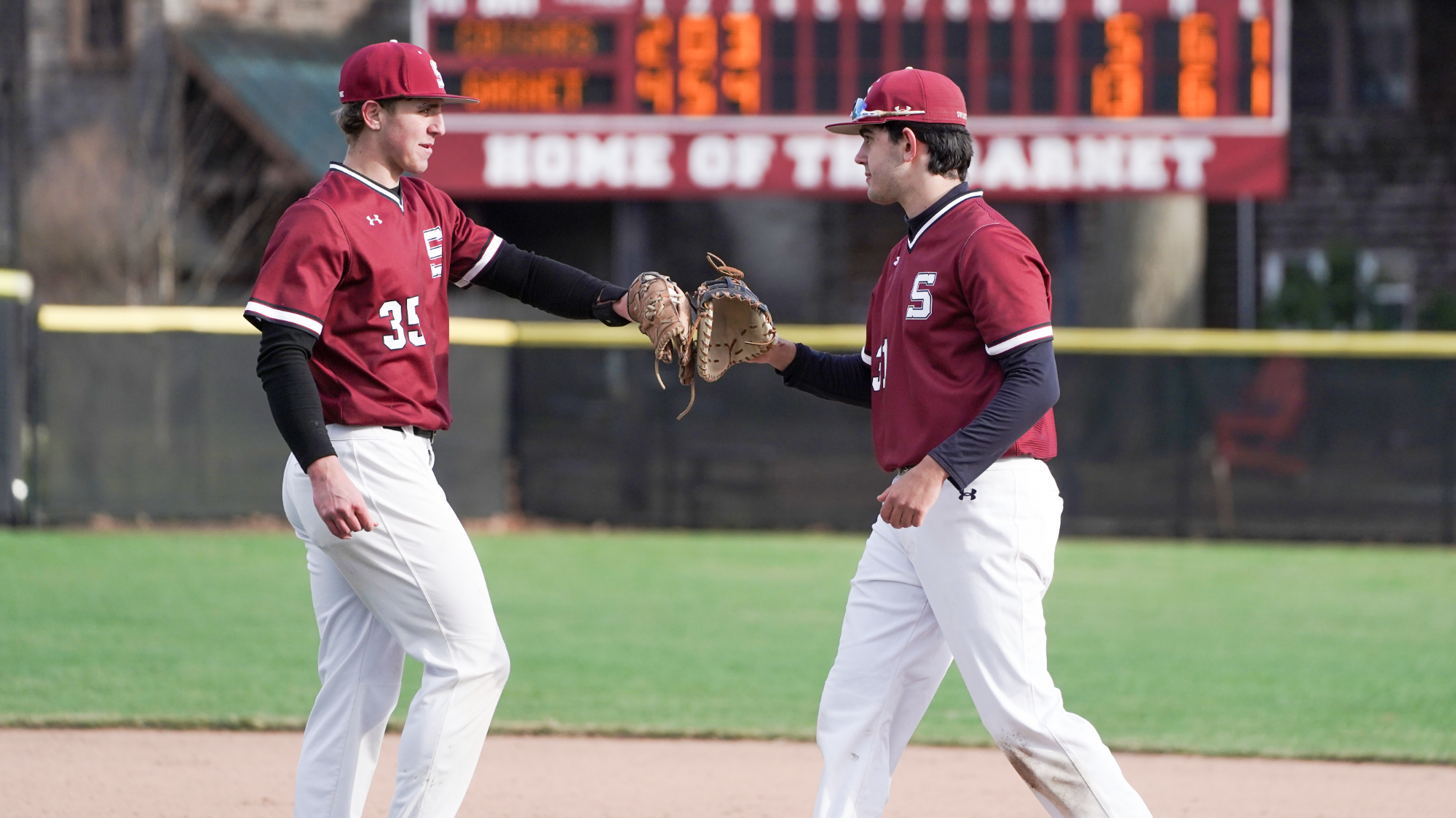 Aidan Tinker and Zac Kahn tap gloves