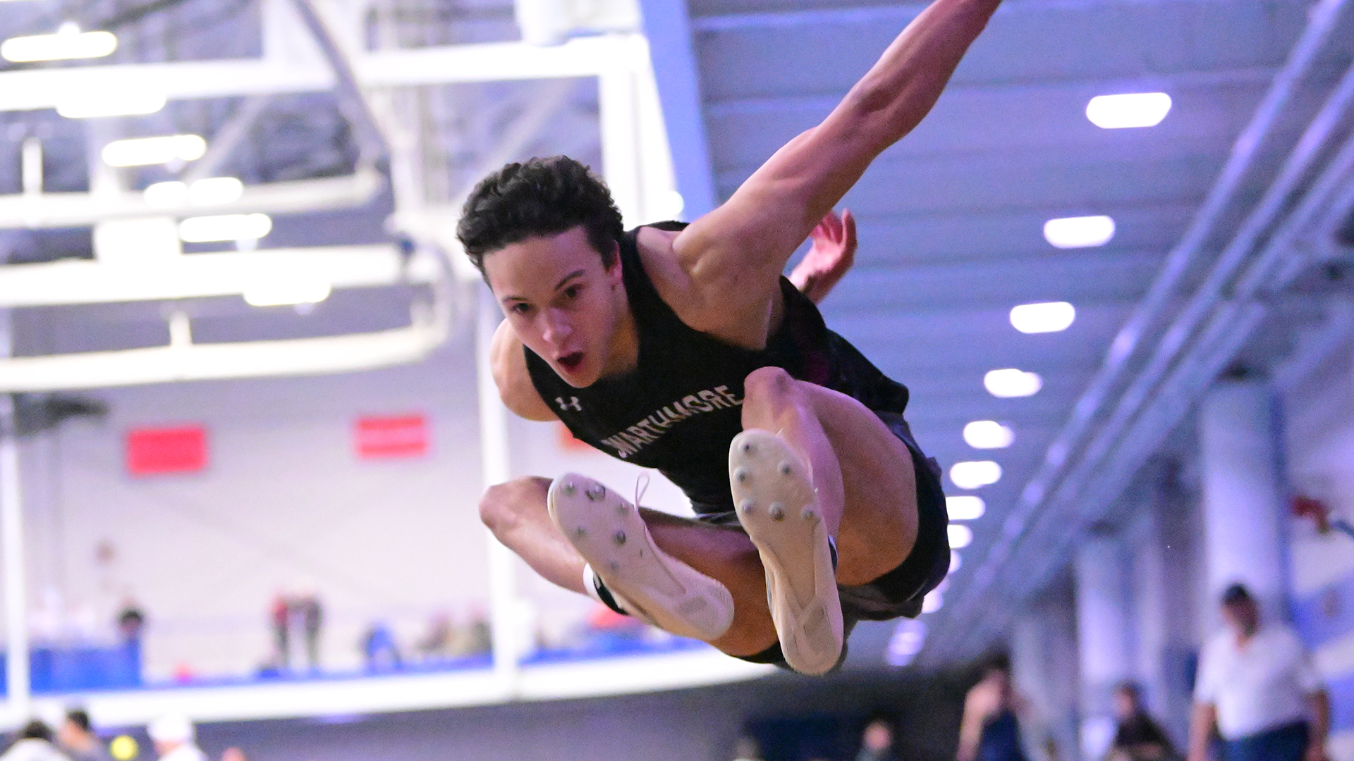Manning competes in long jump