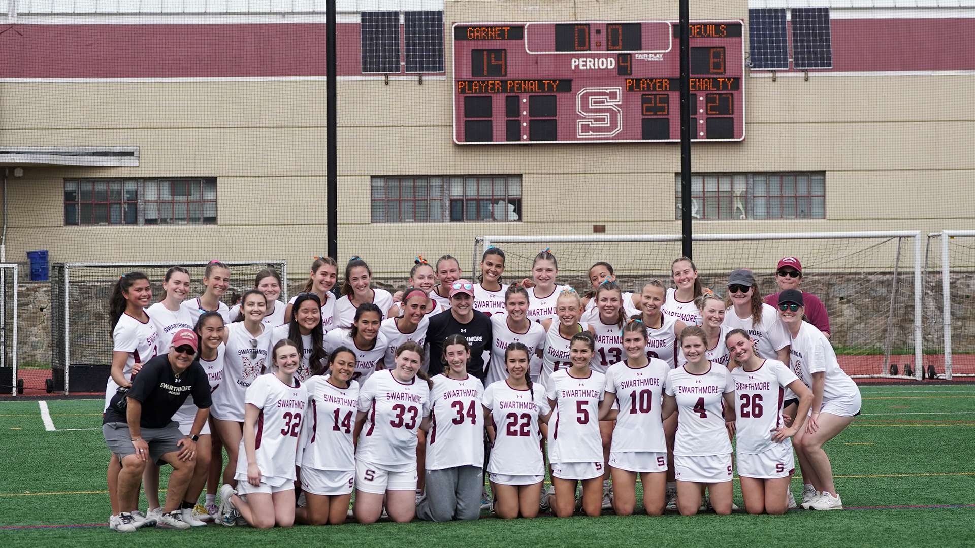 Coach Borbee posses with team after 300th win