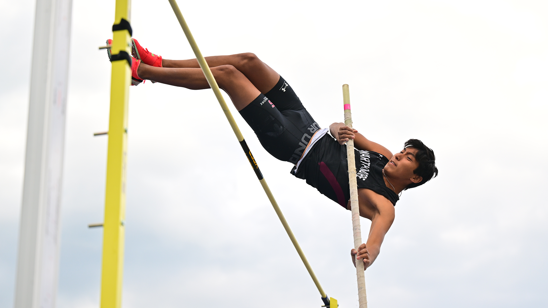 Mejia competes in pole vault