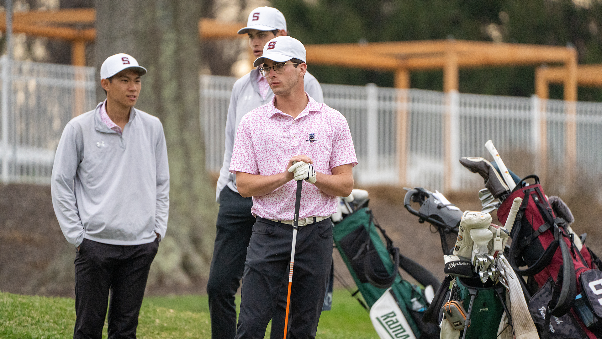 Members of the golf team wait to tee off at home tournament 