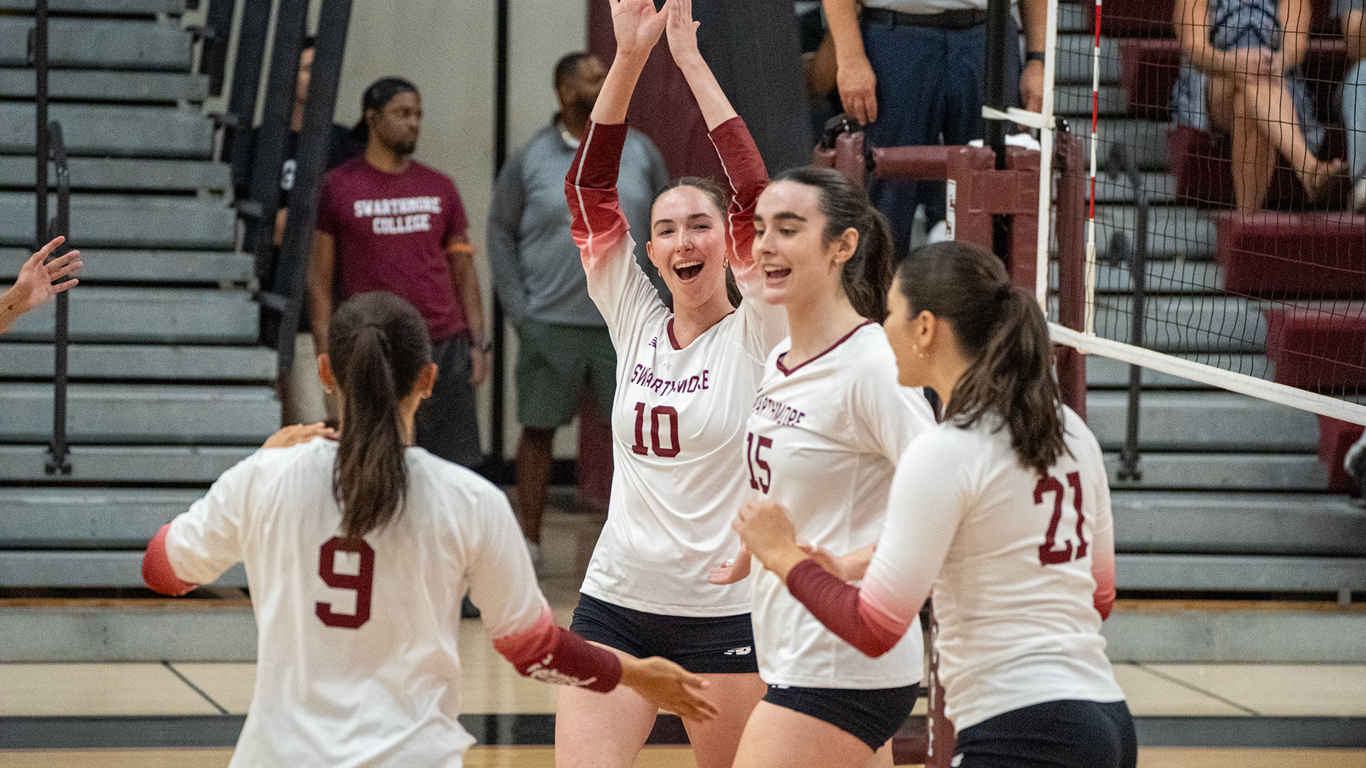 Adam celebrates point with teammates
