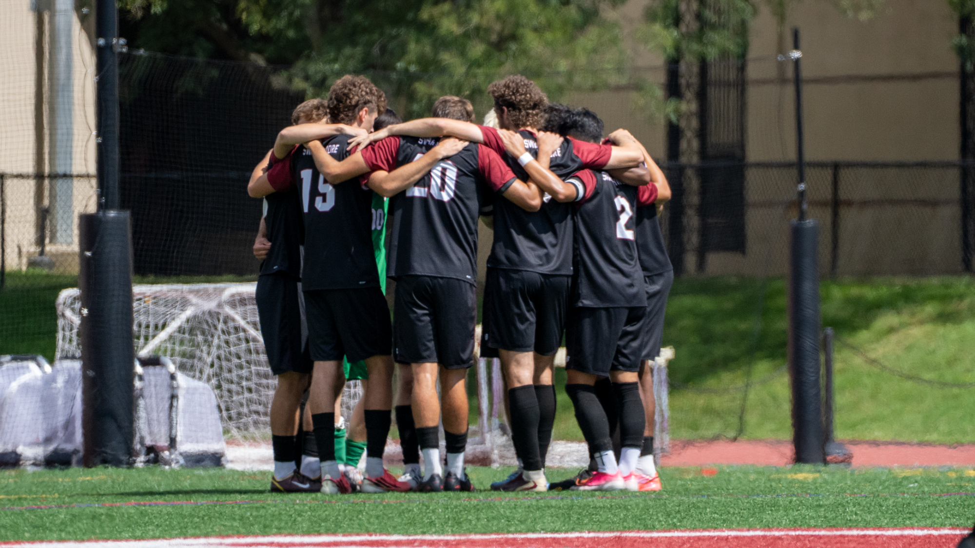 men's soccer huddle
