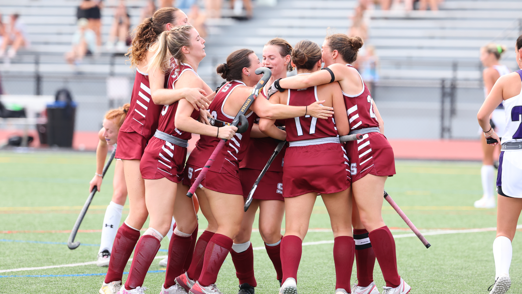 field hockey celebrates goal
