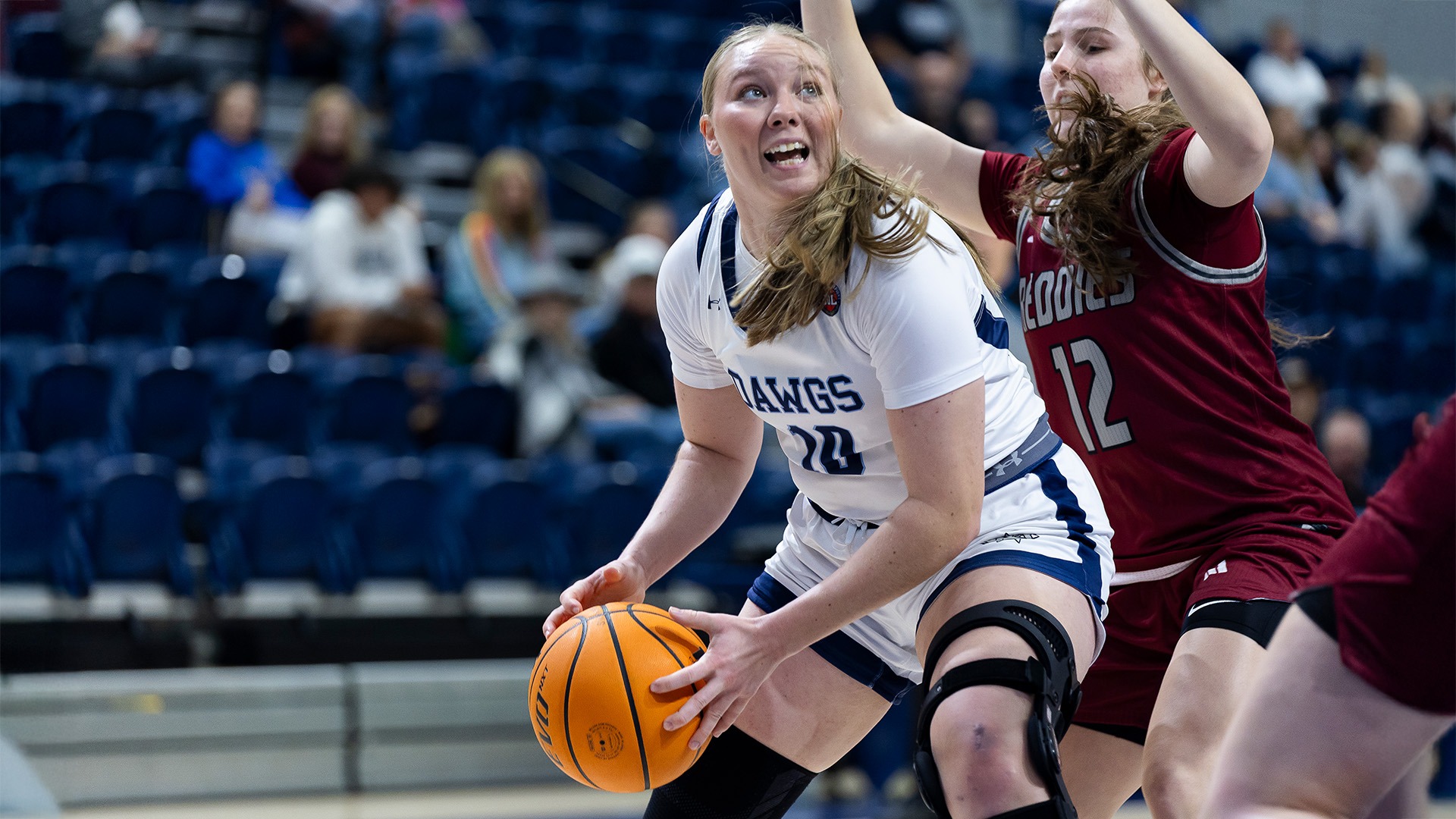Rees Berkey has the ball against HSU